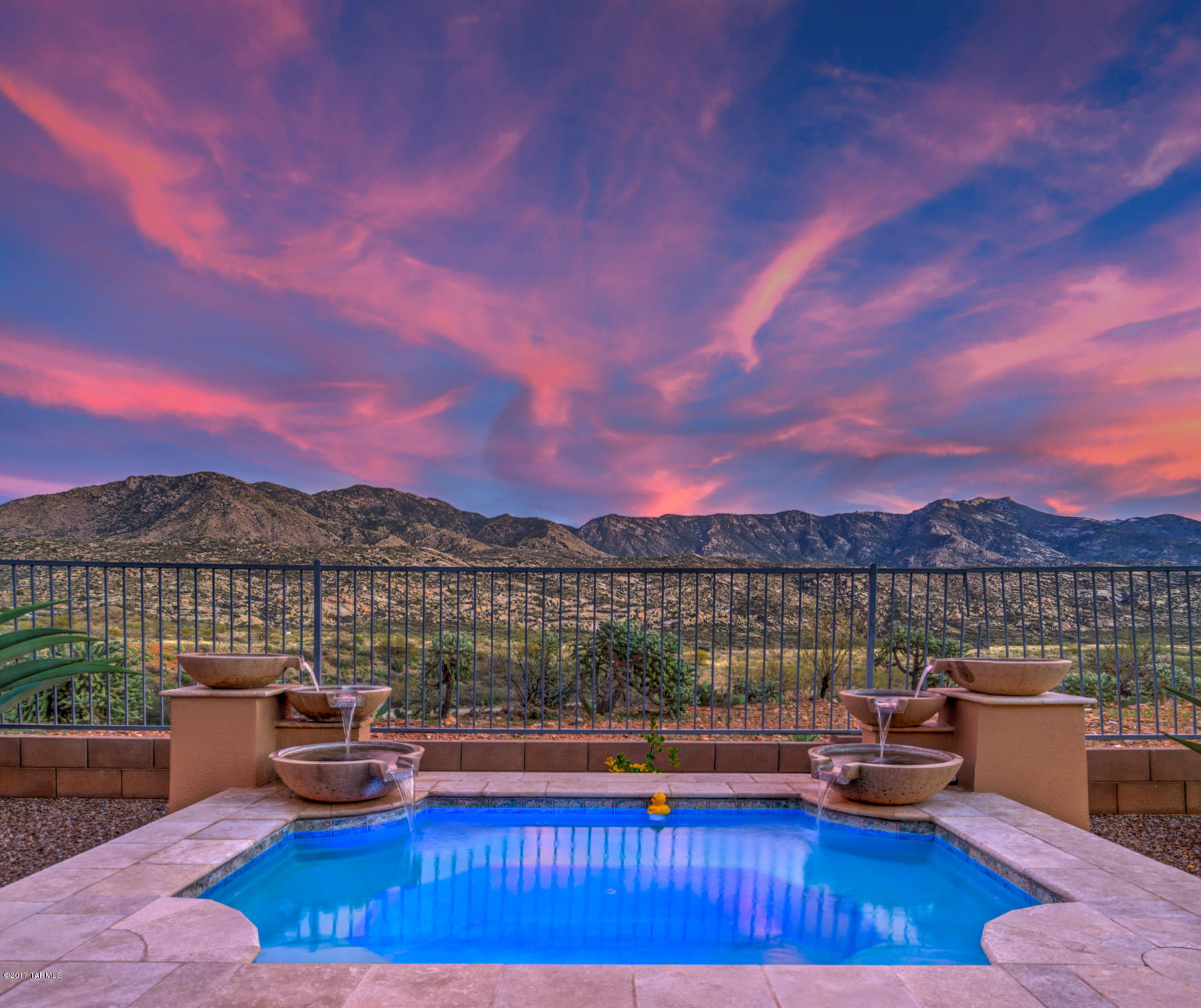 Privacy abounds w/unsurpassed mountain & golf views in this PRESERVE Sonoran model perched high above the golf course. Spacious great room w/custom gas fireplace & wall of windows w/stunning views. This home is the epitome of elegance w/attention to detail everywhere you look. 8 foot alder doors & a customized kitchen w/Monogram SS appliances, granite counters & designer backsplash. Butler’s pantry leads to spacious dining room. Master suite w/separate sitting area & amazing views. An office, 2nd bedroom plus a large casita. Unique 3 car PLUS golf cart garage w/tiled floor &Thomasville cabinets. The firepit, custom spa & tumbled travertine hardscape is ideal for entertaining & enjoying the views.Add’l upgrades & features too numerous to mention. This spectacular Preserve home is a must
