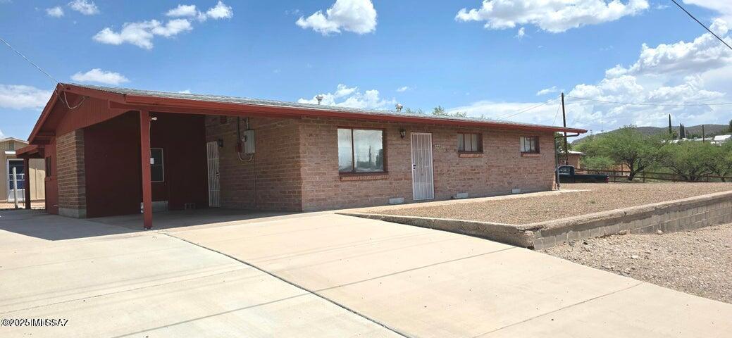 Just a short stroll to Historic Allen Street! This 3 bedroom 1 3/4 bath home is on an elevated lot in a quiet neighborhood. Sliding glass doors in the eat in kitchen open onto the Arizona room.
There is a one car carport, a separate laundry room and a covered patio in the rear of the residence,