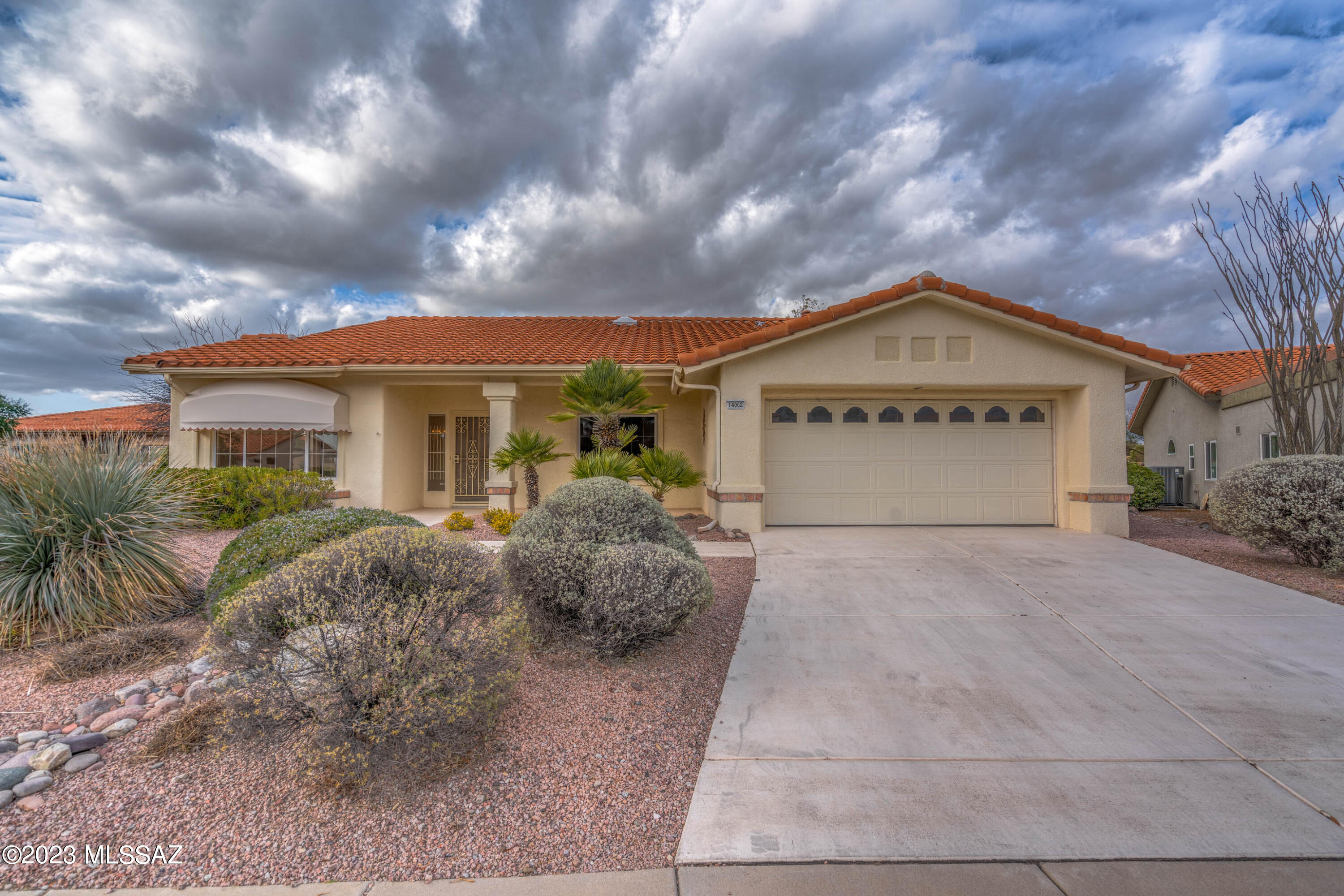 Charming 2BD/2BA (1,779 sq ft) home in Sun City Oro Valley boasts a large, corner cul-de-sac lot, split bedroom plan and front/rear peeks of the Catalinas. Roof replaced in 2016. Living/dining room flows to Great room w/gas fireplace & patio access. Chef's kitchen hosts breakfast bar & nook. Large Owner's suite offers a bay window, double vanities, walk-in shower & huge walk-in closet. Front guest room has window bench seat and bookshelves. Hall bath w/shower. Plank flooring in main living areas and Owner's suite. Extended 2-car garage w/built-in cabinets & epoxy coated floor. Lovely rear yard boasts a covered brick paver patio w/electric awning, lush landscaping and views. Sun City active adult community features a clubhouse, championship golf course, fitness center, 6-lane pool and more!