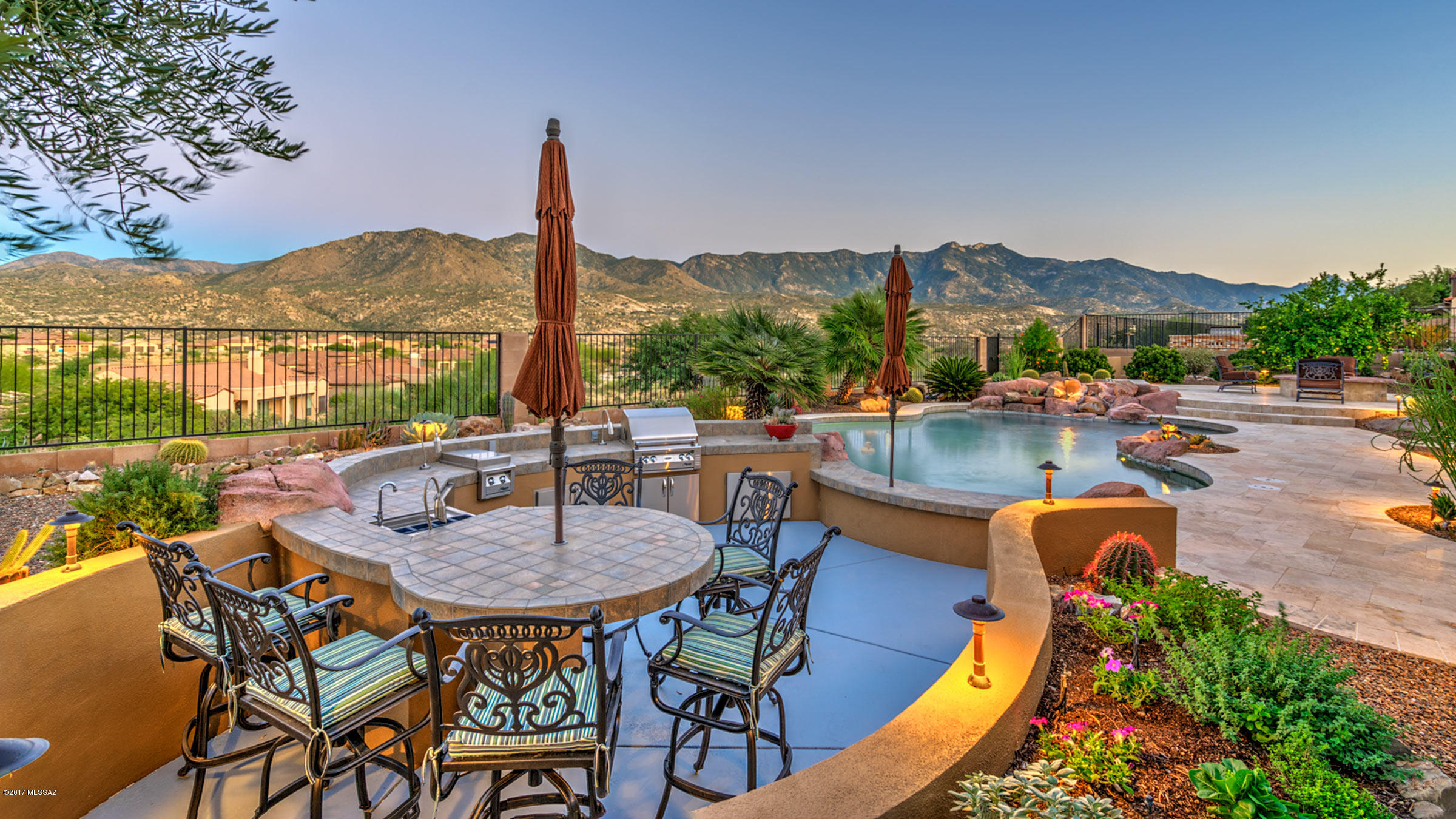 From spectacular mountain views to a backyard oasis featured in Tucson Lifestyle Home & Garden this Sabino has it all! The private courtyard w/lush plantings, fountain & private patio leads to a guest casita. Upon entering this highly customized & upgraded home the mountain views spread out before you. Gourmet kitchen w/stainless appliances, gas cooktop, island, granite counters & designer lighting w/nook/morning room. Master suite w/bay windows & stunning views. Bath w/walk-in shower, soaking tub, dual executive height vanities & walk-in closet. Guest suite w/private bath. Sparkling pool w/swim-up bar, sunken kitchen, water feature, firepit w/the dramatic views as a backdrop. Den, powder room, decorator colors & plantation shutters, plus 3 car garage complete this perfect Preserve home.