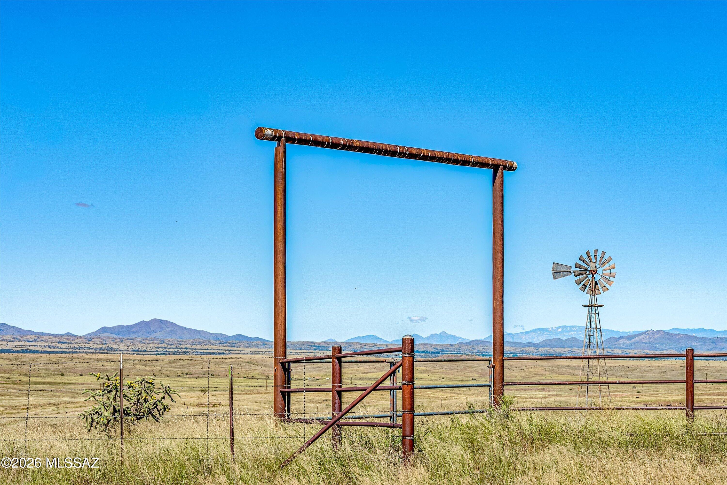 Shovel-Ready 18.42-Acre Estate Parcel in Sonoita-Elgin Wine Country Create the rural lifestyle, horse property, vineyard retreat, or wine-country home you have envisioned on this exceptional 18.42-acre parcel in the heart of Arizona's sought-after Sonoita-Elgin wine country. Fully fenced and cross-fenced, the property is exceptionally well positioned for horses, livestock, a private estate, or a carefully planned country compound--with valuable infrastructure already in place. The parcel is served by a productive private well (Well No. 55-213865) with a 460-foot total depth, 6-inch casing, and a newer Goulds 2 HP pump. A four-hour pump test stabilized at approximately 15 GPM, with only 32 feet of drawdown from a static water level of 261 feet. Underground power is available along the east boundary, and a custom pipe entryway provides a strong, welcoming arrival. A windmill is present and offers a charming restoration opportunity.
Enjoy direct proximity to BLM land along the north boundary, placing hiking, biking, and horseback riding virtually at your doorstep. With no CC&Rs, no FEMA-designated floodplain reported, and only minimal local regulatory considerations near the northwest corner, this property offers the freedom to shape your own vision in one of Southern Arizona's most scenic and celebrated rural communities. For buyers seeking usable acreage, water, fencing, access to utilities, and the enduring appeal of Sonoita-Elgin's vineyards, open country, and outdoor lifestyle, this is a rare opportunity to begin building without starting from scratch.