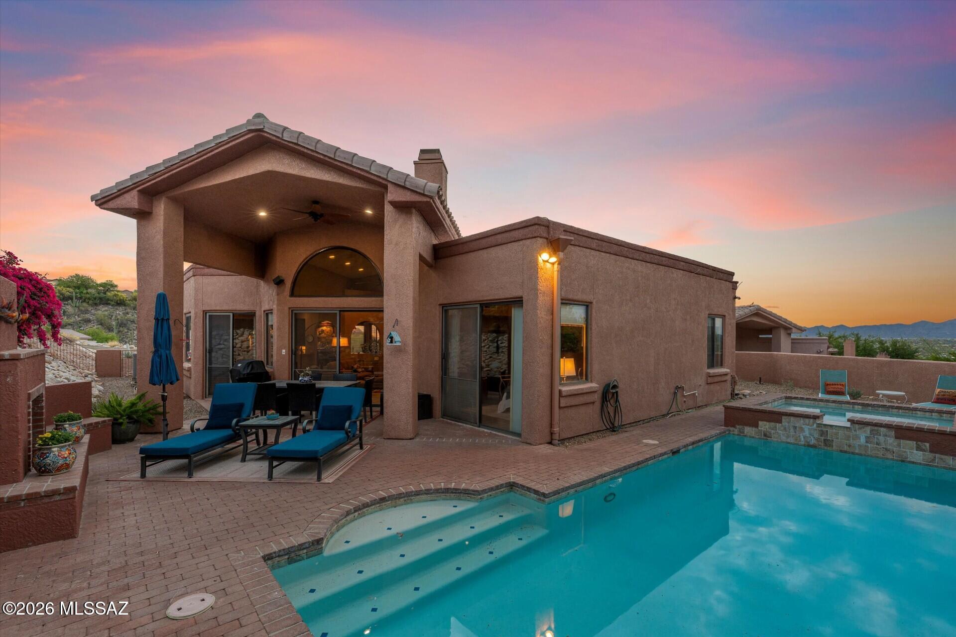 Enjoy breathtaking Pusch Ridge views from this welcoming 3-bedroom, 2-bath home in the highly sought-after gated community of La Reserve.
Clerestory windows fill the interior with light, while soaring ceilings and an open-concept great room with gas fireplace flow
 into the updated kitchen with granite countertops, double oven, and stainless-steel appliances. The formal dining room is ideal for entertaining.

Step through 8-foot sliding glass doors to a private backyard retreat featuring a built-in gas fireplace, beautifully refinished pool and spa,
 and tranquil Zen-inspired seating area. Enjoy fresh Meyer lemons and oranges from your own trees.

The 2,025-square-foot single-story home offers a spacious primary suite with backyard access and an updated bath with dual vanities, separate shower, and soaking tub. Two additional bedrooms provide flexibility for guests, an office, or den. The residence is conveniently
 located near dining, shopping, golf, and hiking. This exceptional home captures the very best of Arizona living.