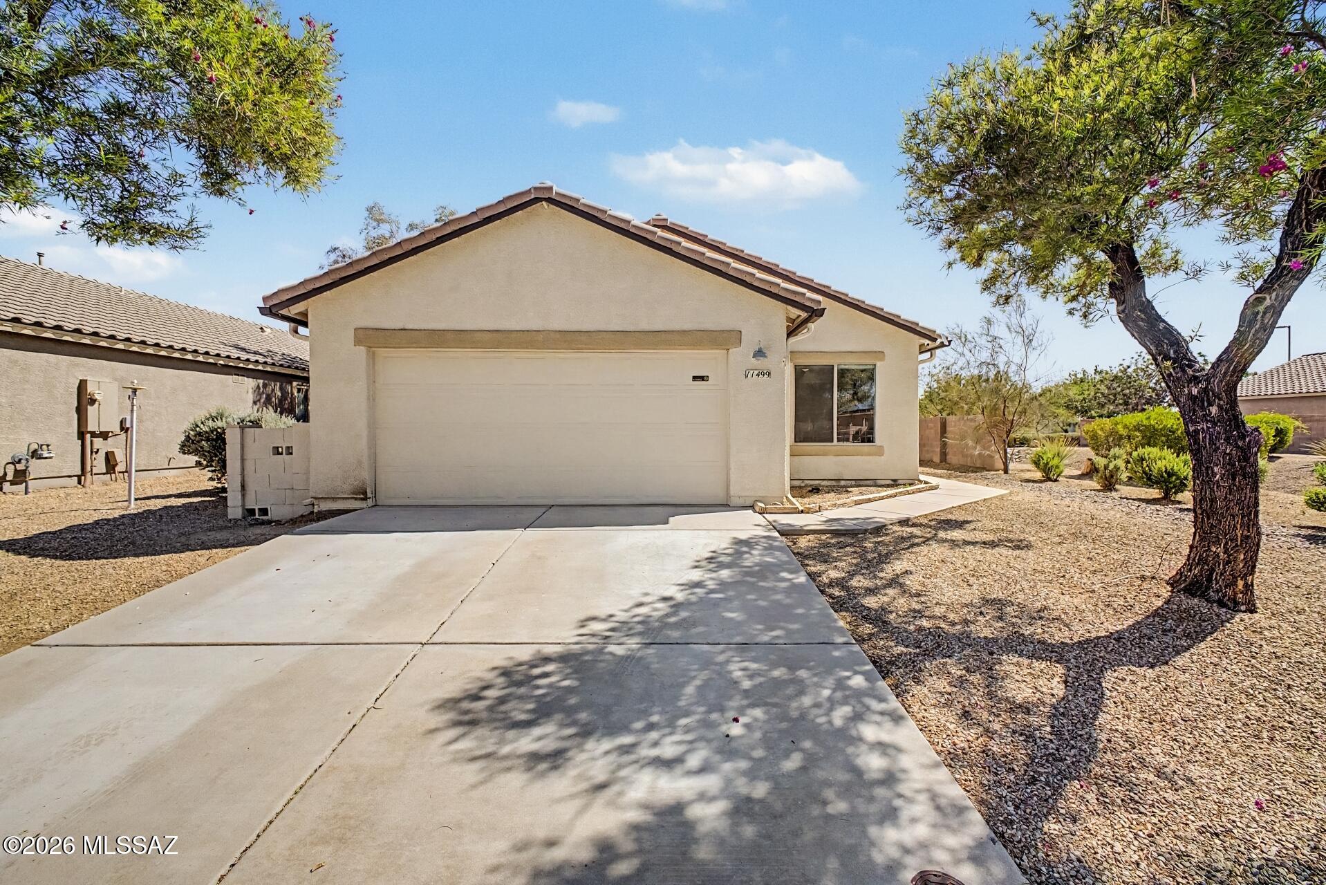 Move-in ready 4-bedroom, 2-bath home in the established San Lucas community of Marana. New LVP flooring, new quartz countertops, fresh interior paint, and a new water heater make this home truly turnkey. The great room flows into a kitchen with a dining nook -- comfortable and practical for everyday living. No neighbors behind you, an open easement to the west, and a full-amenity park just steps away featuring a dog park, shaded playground, basketball and volleyball courts, fitness stations, ramadas with grills, restrooms, and access to a shared-use path. The 2-car garage, backyard shed, and extended paver patio make this home as functional outside as it is inside. Solar keeps your summer bills low. Professionally cleaned, roof serviced, termite treated -- waiting for you to call it home.