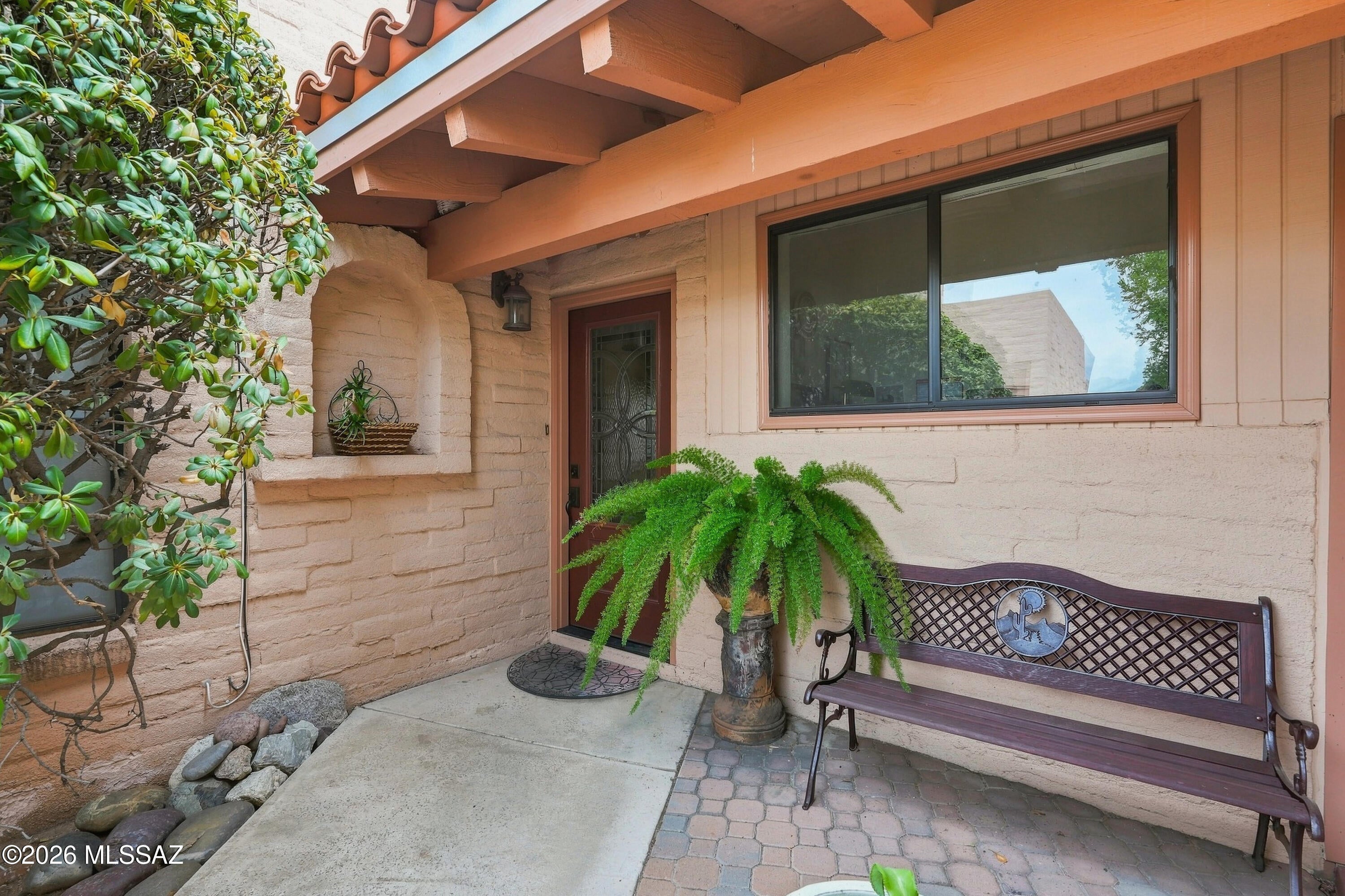 This fully furnished 2-bedroom, 2-bath Tucson townhome offers 1,487 sq ft of comfortable single-level living with plenty of character throughout. Slump block construction, Mexican tile, warm wood finishes, skylights, and a wood-burning fireplace give the home a distinctive Southwest feel. The layout includes a spacious living room, formal dining area, breakfast nook, and a generous primary suite with a large walk-in closet. Outside, a private courtyard and covered patio are surrounded by mature greenery, including a citrus tree and grassy area. A 2-car garage adds convenience and storage. Located in La Esperanza Town Homes and offered fully furnished, this home is ready to enjoy as a primary residence, seasonal getaway, or lock-and-leave option.