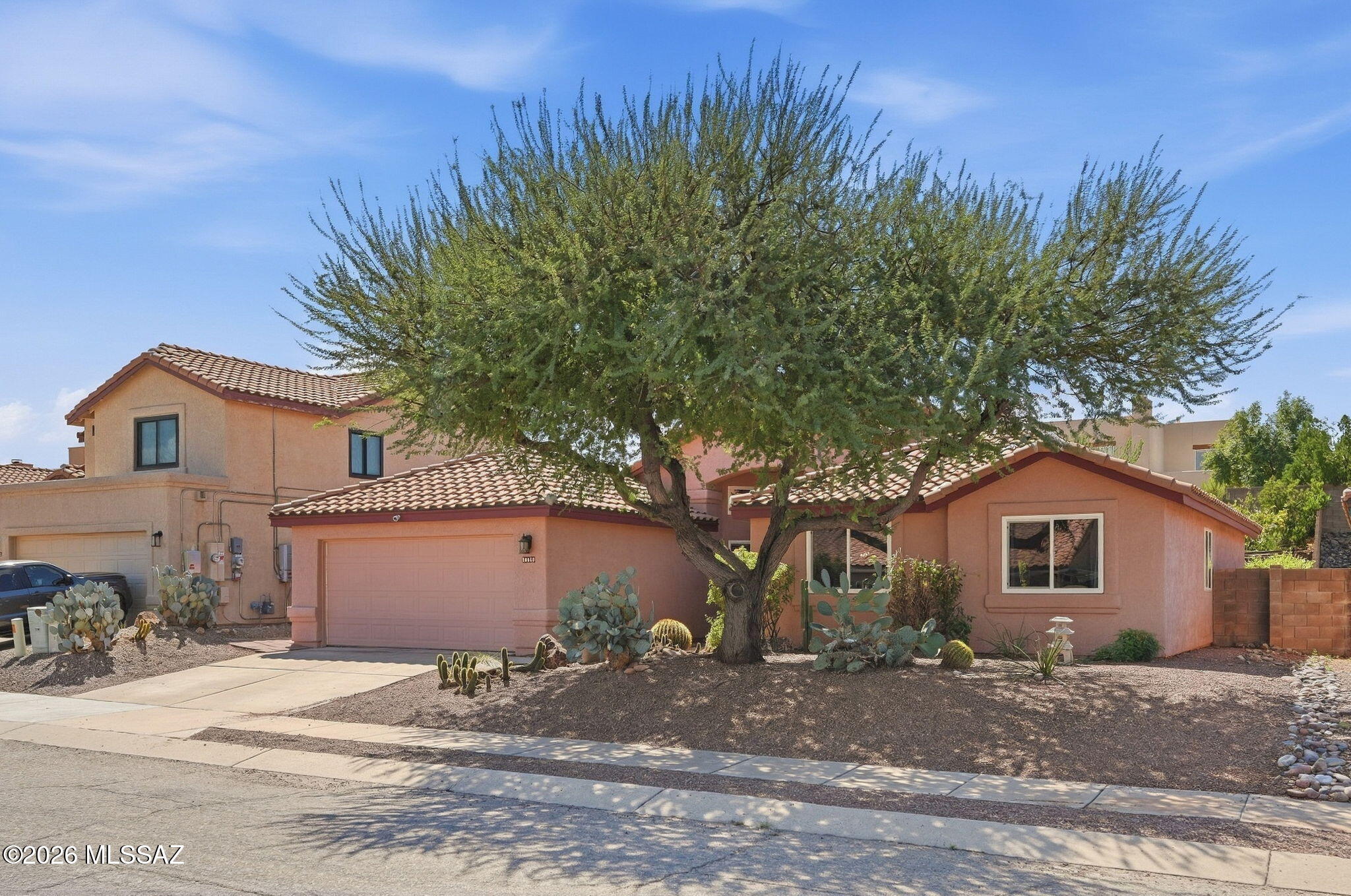 Energy efficiency and thoughtful updates make this beautifully maintained home a stand out. Vaulted ceilings, Saltillo tile and laminate flooring offer warmth and character. The kitchen features stainless appliances, newer butcher block counters, Talavera tile accents and backsplash, plus an R/O system. Updated bathrooms include walk-in showers, while the primary bath adds a relaxing soaking tub. HVAC, roof and pipes have been replaced (no poly!) which adds peace of mind. Owned solar and newer windows mean low energy bills.  Step outside to a lush, thoughtfully designed backyard with an extended patio, fruit trees, herb and vegetable gardens and composting area. No pesticides! An artfully crafted retaining wall and winding path add charm and create a wonderful space to explore and enjoy.