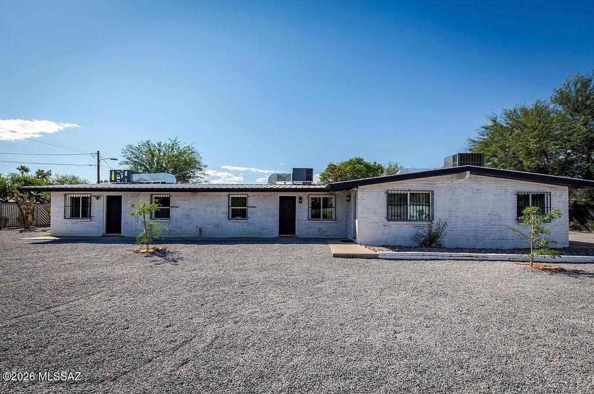 Turn-key triplex in prime central Tucson location offering an excellent investment or owner-occupant opportunity. Completely remodeled just 3 years ago with metal roof, newer AC units, updated flooring, paint, appliances, and electrical for low-maintenance ownership. Property features three units with ample parking on a large, fully gated lot with rare space for RVs, trailers, work vehicles, or additional storage. Bonus detached finished studio/shed with electricity, insulation, drywall, vinyl flooring, and mini-split AC/heat--perfect for a home office, workshop, or flex space. Conveniently located minutes from TMC, Banner Hospital, the University of Arizona, shopping, gyms, and The Loop bike path. Great opportunity to live in one unit and rent the others or income property.