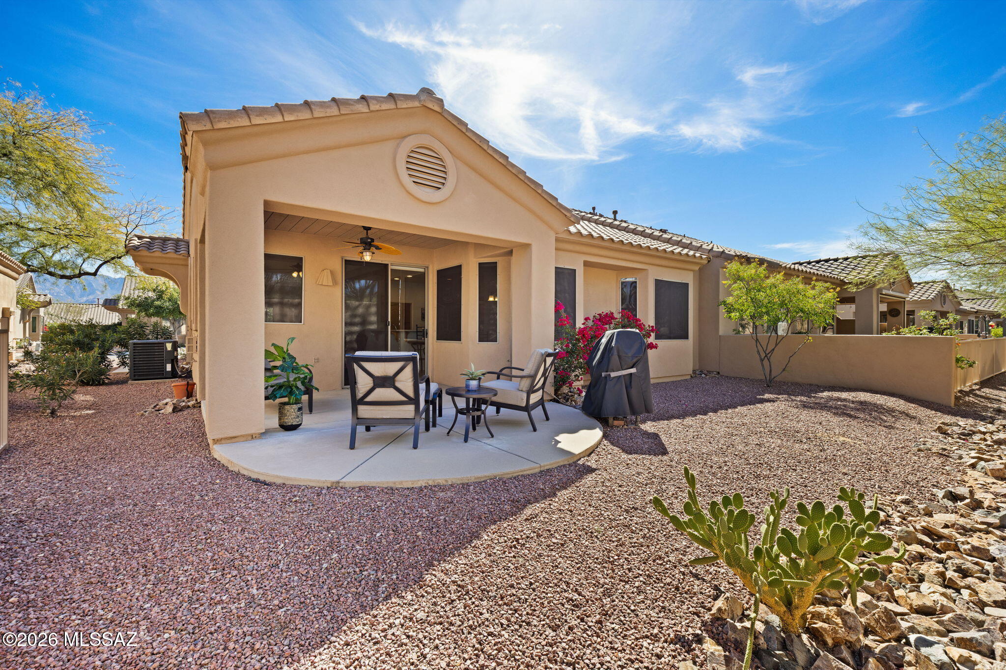 Enjoy easy, low-maintenance living in the gated active adult community of Vistoso Village in Rancho Vistoso. This beautifully maintained Buena Vista floor plan offers 2 bedrooms, 2 bathrooms, a spacious great room, vaulted ceilings, gas fireplace, and split-bedroom layout for added privacy. The bright kitchen features abundant cabinetry and dining space, while the primary suite includes a walk-in closet, dual vanities, and walk-in shower. Private patio ideal for enjoying Arizona mornings and outdoor living. Sellers are motivated and willing to work with buyers bringing a reasonable offer. Most furnishings may convey, creating a turnkey lock-and-leave opportunity, though home may also be purchased unfurnished based on buyer preference. Per HOA guidelines, rentals are permitted with a 30-day minimum term, subject to registration and compliance with community rules and age-restricted requirements; buyer to verify current HOA policies.

The monthly HOA fee includes water, sewer, trash, cable TV, in-home Wi-Fi, front and rear yard landscaping, pest control, roof coverage, structure insurance, exterior paint, gated entry, and access to the community clubhouse.

Community amenities include pool and spa facilities, fitness center, billiards, library, and organized activities. Convenient Rancho Vistoso location near shopping, dining, medical services, golf, and recreation.
