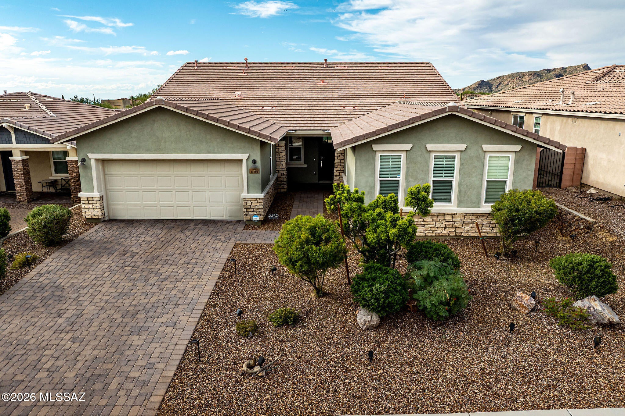 Beautiful single-story home located in the gated Golden Barrel Place community of Dove Mountain. Built in 2021, this spacious 4-bedroom, 3-bath home offers over 2,500 sq. ft., plus a private enclosed den with French doors and a formal dining room. 
The impressive kitchen features white cabinetry with crown molding and upgraded hardware, quartz countertops, a tiled backsplash, oversized island with seating for four, pendant lighting, recessed can lighting, and a large undermount sink with spray faucet. Stainless steel appliances include a French-door refrigerator, gas cooktop, built-in oven and microwave, dishwasher, and decorative hood. The kitchen opens to the family room, where a 12-foot sliding glass door leads to the covered patio, creating a great indoor/outdoor living space. The primary suite features: Quartz countertops, dual rectangular undermount sinks with upgraded fixtures and an oversized walk-in shower with multiple shower heads. Beautiful tile extends to the ceiling with a decorative accent band, while clerestory windows bring natural light into the bathroom. Additional bathrooms feature tile surrounds, quartz countertops, modern rectangular undermount sinks, and upgraded fixtures. Additional interior features include attractive tile plank flooring and 8-foot interior doors.
The laundry room includes a washer and dryer, utility sink, and overhead shelving. Additional features include a 3-car tandem garage, overhead storage system, water softener, and reverse-osmosis water purification system.
The exterior features attractive stone accents, a brick paver driveway, and professionally landscaped front and rear yards with mature trees and shrubs, artificial grass, decorative rock, automatic drip irrigation, and a gutter system.
Enjoy an incredible backyard setting with no home directly behind, view fencing that is snake proofed, and an open feel. Conveniently located near the Ritz-Carlton Dove Mountain, golf courses, hiking and biking trails, and the many recreational opportunities Dove Mountain has to offer.