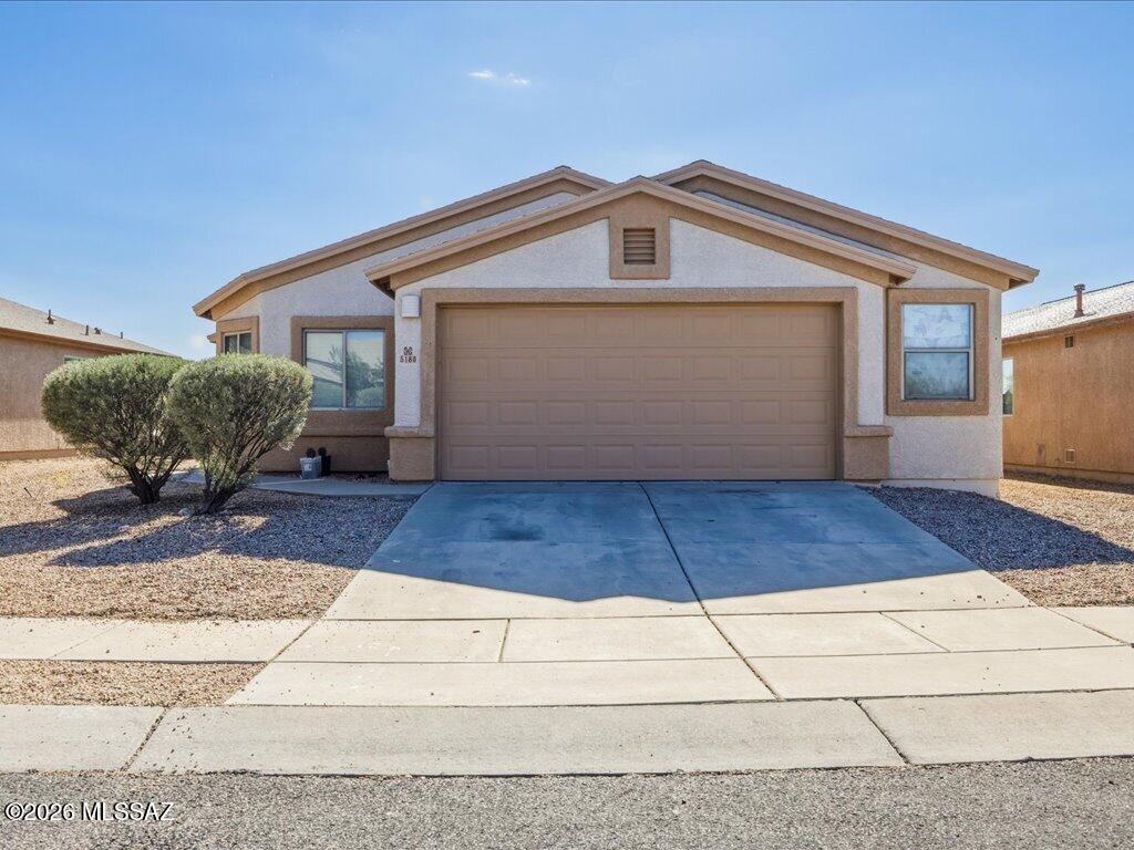 This thoughtfully designed split-bedroom floor plan offers both comfort and flexibility, with a bonus room just off the living area that can easily serve as a 4th bedroom, playroom, media room, home office, or whatever fits your lifestyle best. The spacious kitchen features stainless steel appliances and is open the family room which makes for great entertaining. Ideally located near Tucson Marketplace, shopping, dining, and everyday conveniences are all just minutes away. Plus, with quick access to I-10, commuting around town is simple and convenient. This home offers the space, function, and location you've been looking for--you're going to love living here.