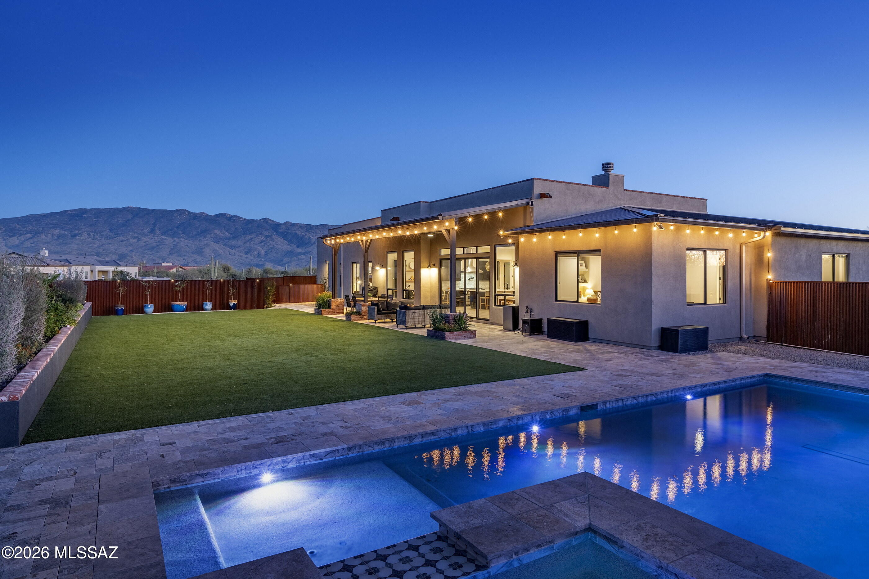 Situated on just over an acre within the prestigious gated community of Rancho Soldados, this exceptional residence offers 5 bedrooms, 3.5 bathrooms, and a dedicated office - delivering the space and refinement today's discerning buyer expects. Soaring ceilings with wood beam accents and custom tile work establish a sense of warmth and architectural character throughout. The open-concept great room connects effortlessly to a well appointed kitchen featuring a generous island, stainless steel appliances, bar seating, and ample space for both everyday living and elevated entertaining. A split floor plan provides thoughtful separation of private and communal spaces without compromising the home's natural flow. The backyard is equally impressive - an expansive covered patio overlooking sweeping mountain views, a lush turf lawn, and a sparkling pool with spa and Baja shelf create an outdoor environment designed for year-round enjoyment under the Sonoran sun. 

Positioned in the coveted Tanque Verde corridor - Mount Lemmon, the Santa Catalinas, and Agua Caliente Regional Park can all be reached within minutes, placing some of Tucson's finest natural landscape right at your doorstep.