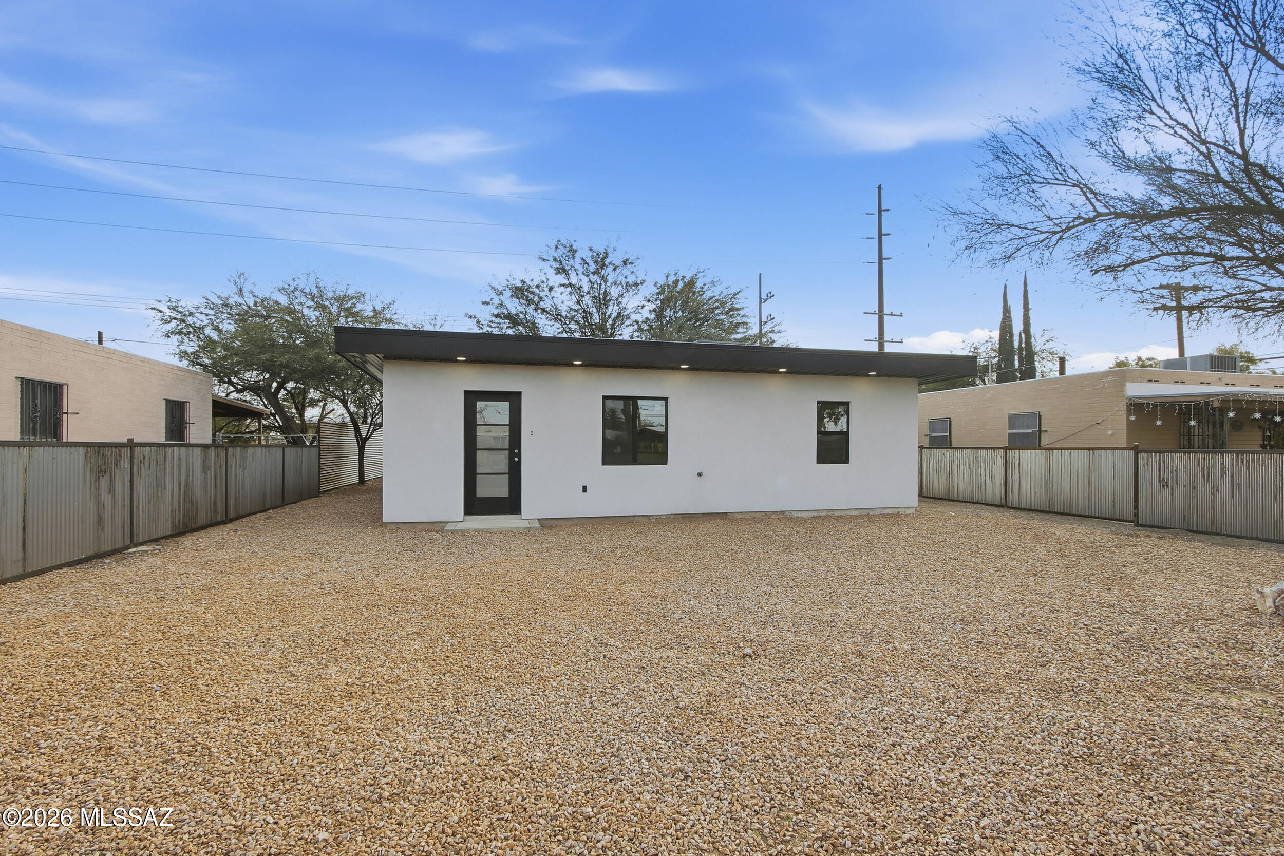 Modern charm meets central Tucson convenience! This fully remodeled 2 bed, 1 bath home is move-in ready and packed with style featuring an open concept layout, sleek contemporary kitchen, and a spa inspired bathroom with designer finishes. Step outside to a spacious, fully fenced backyard complete with a private concrete patio deck and mature shade tree, creating the perfect setting for morning coffee, entertaining, or relaxing evenings. Low maintenance landscaping, perfect for pets, entertaining, or creating your own outdoor oasis. Located just minutes from popular parks, local eateries, and unique neighborhood shops, this home offers the ideal blend of comfort, privacy, and vibrant city living. A rare turnkey opportunity you won't want to miss!