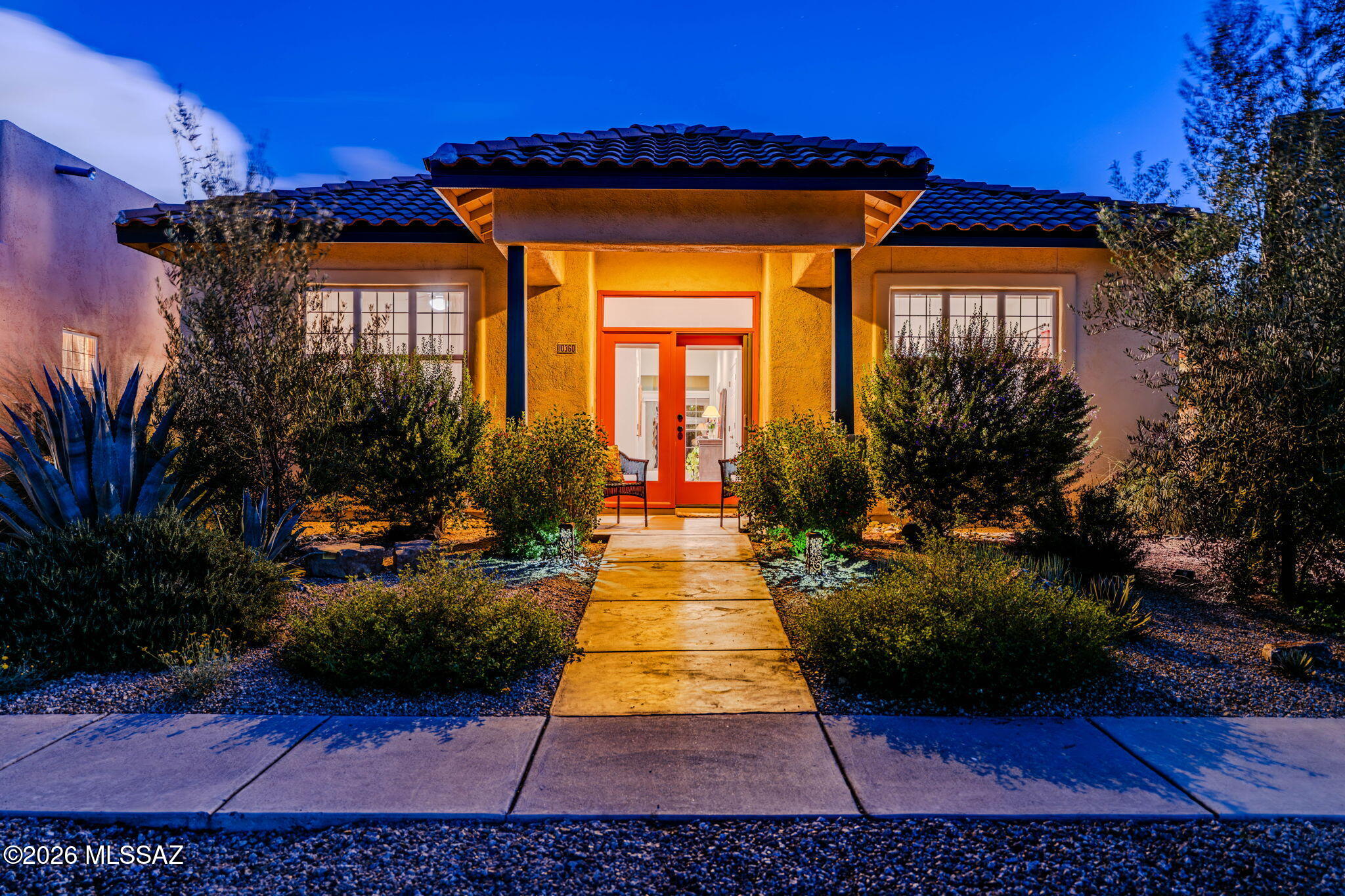 Beautiful single-level home in the heart of Civano offering 3 bedrooms, 2 baths and 1,556 sq ft, plus a detached 2-car alley-access garage. The light-filled interior features laminate flooring through much of the home with carpet in the secondary bedrooms, stainless-steel appliances, gas range, shaker-style cabinetry with roll-out shelving, dining area, breakfast bar and dual-sink vanities in both bathrooms. A whole-house UV air filtration system integrated into the HVAC adds an appealing indoor air-quality feature. Step outside to a deep covered rear porch and professionally designed desert landscaping featuring decorative gravel, brick, tile and flagstone hardscape, complemented by reclaimed-water irrigation. Set on an interior Civano lot away from heavier through-traffic, the home enjoys the neighborhood's distinctive sustainable design, community pools, parks, walking paths, tennis, pickleball and welcoming pedestrian-friendly atmosphere, all within the Vail School District.