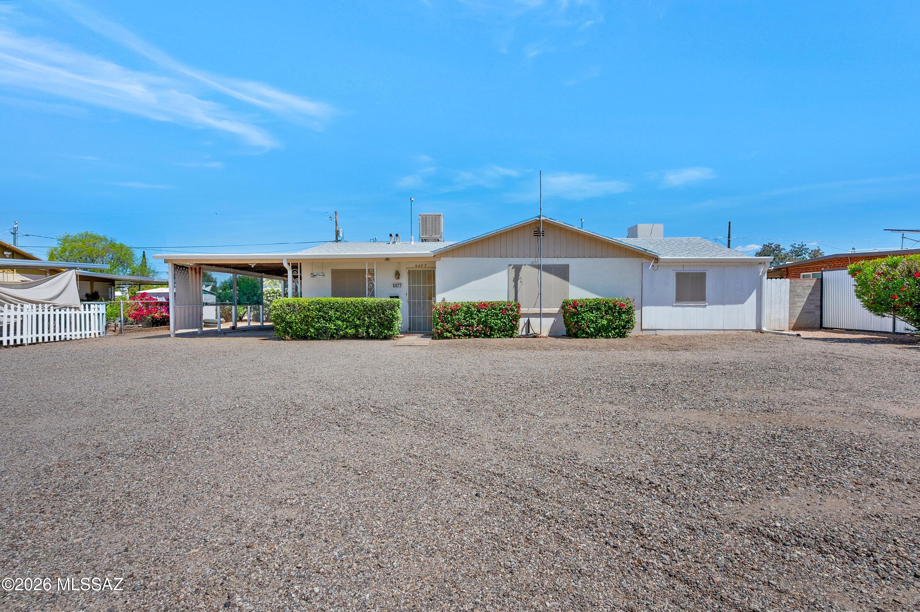 Washer, Dryer, Fridge & Gas Range included. Large home, large lot! No HOA. This property features a detached 20x20 workshop on .25 acre lot. Plenty of room for RV, boat, trailer. The home offers 4 bedrooms and 2 baths, along with a eat-in kitchen and the option of a separate dining room (which can easily be converted to Bedroom 5). You'll also find a large living room and a bonus area for hobbies, gaming or home office. Covered parking for 4 on the side of house and workshop. See the attached floor plan for details. Check out disclosures for Water Main Line (2020) and Electrical Panel (2020). Close to Mesa Village neighborhood park. Opportunity is knocking! Move in and make it yours.