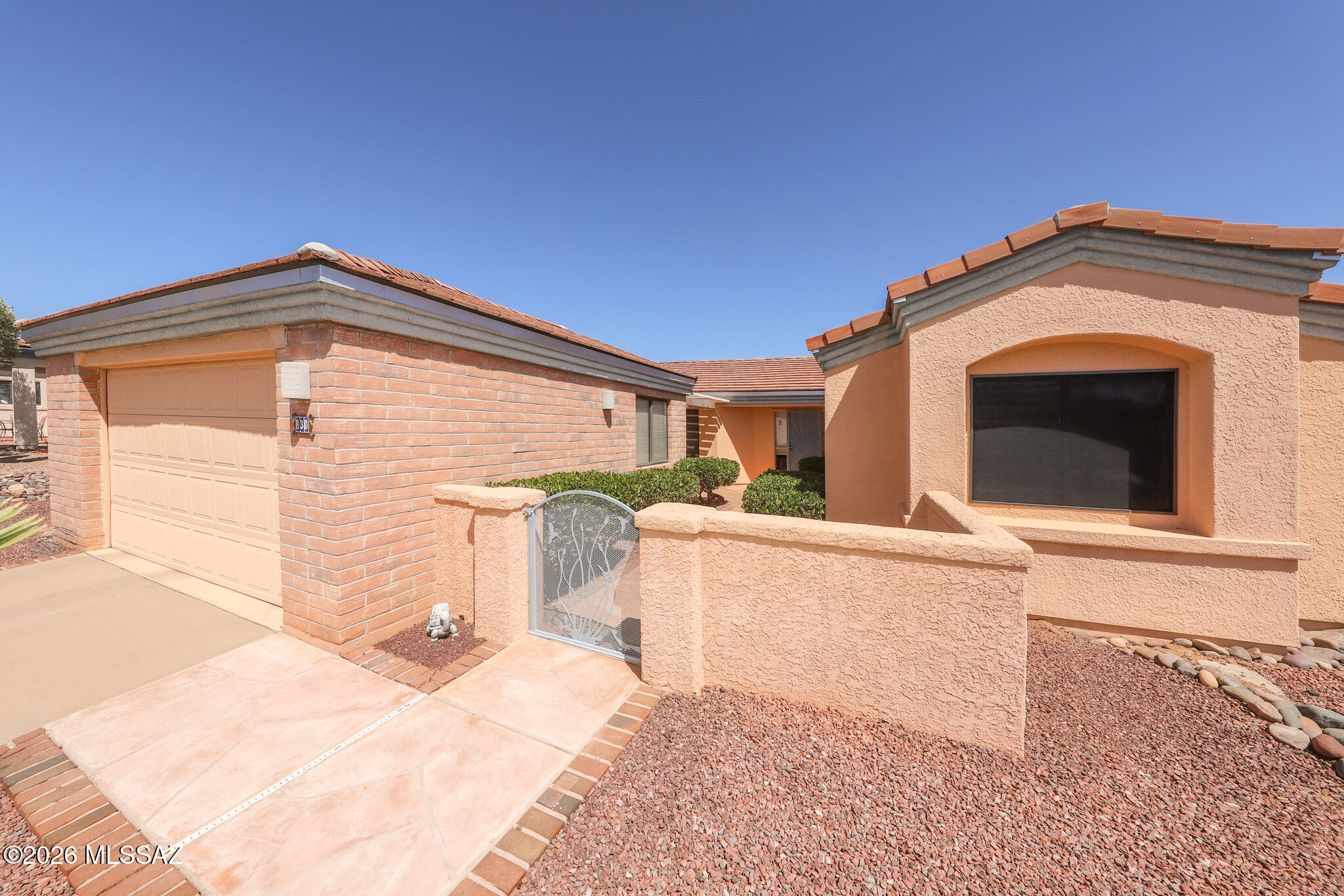 Enjoy comfortable Arizona living in this charming 2 bedroom, 2 bath home located in a quiet Green Valley neighborhood. Thoughtfully designed with a spacious den off the primary suite, offering flexibility for a home office, hobby room, or private retreat. Two cozy fireplaces add warmth and character, abundant storage throughout including 2 primary closets, walk-in showers in both bathrooms, granite countertops, peek-a-view of the mountains from the front courtyard. Enjoy easy access to shopping, dining, and Green Valley Recreation amenities. Recent updates include a new roof & water heater for added peace of mind. Ask about 2.99% Assumable loan option as well!