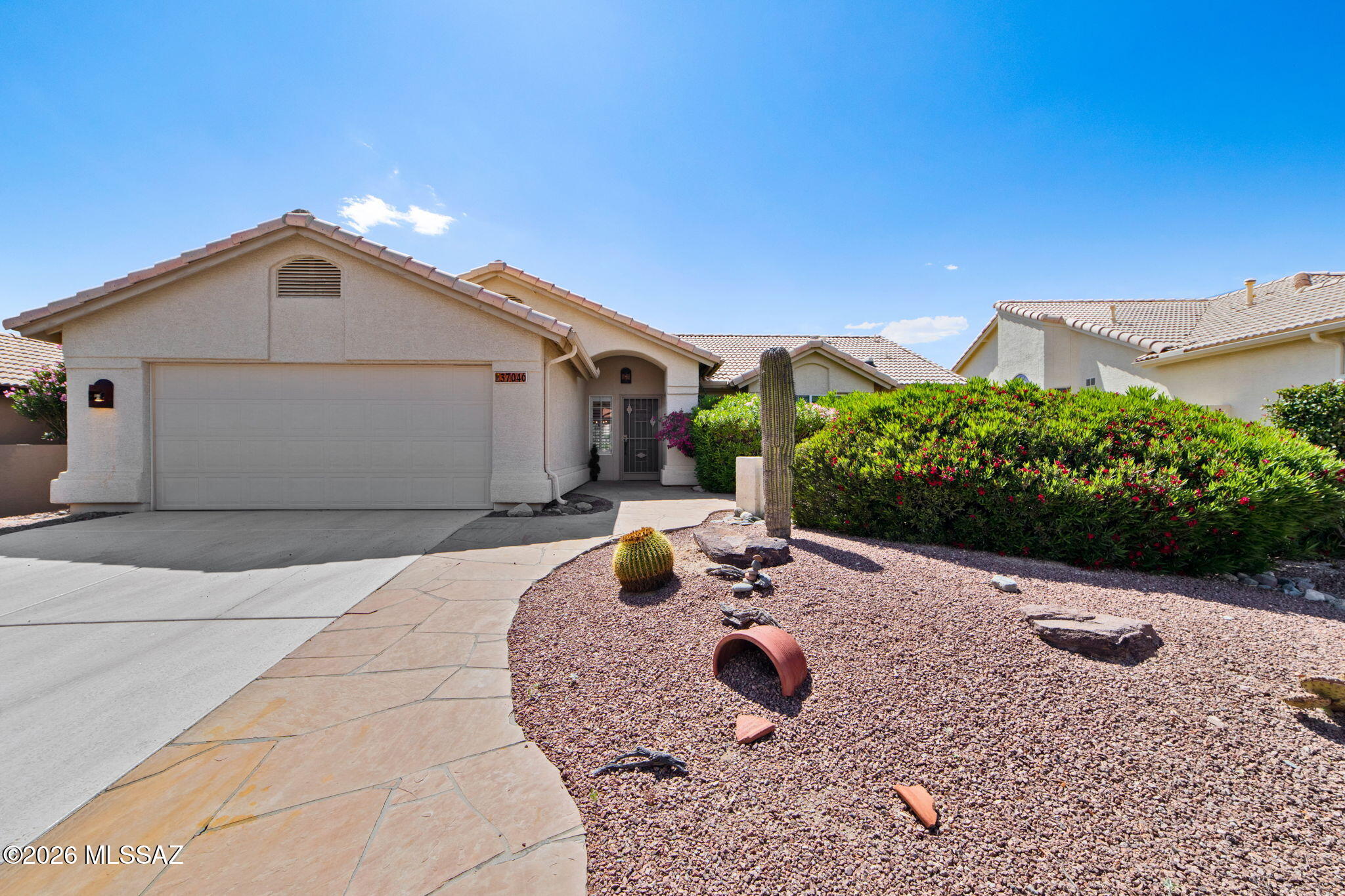 Seller to entertain/counter offers from $425k-$450k. Welcome to Rock Crest Drive in the Highly Desirable SaddleBrooke 55+ Community! This delightful, move-in-ready home is ready to become your new residence, located north of Tucson. This active adult community offers a resort-style lifestyle with golf course views and panoramic Catalina Mountain views. This one-bedroom home offers 1,422 sq ft of living space, including a den (a possible second bedroom) and two upgraded bathrooms, making it perfect for downsizing, a vacation home or year-round living. The Sonora floor plan is exactly what you are looking for. The large great room is ideal for hosting or relaxing while enjoying the fireplace on chilly Tucson nights. The open plan includes a fully functional kitchen with ample counter space, an electric range, plenty of quality cabinetry and a dining/breakfast nook area. Just off the entry and great room is the den, perfect for a home office or craft room. A Murphy bed, perfect for guests, is hidden behind the concertina doors and offers a mountain view from the front of the home. 
The split floor plan ensures privacy. The Owner's Suite is located at the rear of the home with a sliding door to the back patio, pool area and extended patio. The luxurious ensuite features a double vanity, granite countertop, heated floor, an oversized walk-in shower, and a walk-in closet.
The elevated home is positioned to maximize the view, offering unobstructed sights of the Golf Course, the Catalina Mountains and the ever-changing desert with no rear neighbors.  Enjoy your own private sanctuary as you relax on the extended covered patio, complete with ceiling fans. Cool off in the sparkling pool, which features custom landscaping, a cool deck and elevated seating overlooking the golf course. An aluminum ramada is also attached to the patio; it includes a built-in gas BBQ and more entertaining space.
The SaddleBrooke community offers extensive amenities and over 100 social clubs. Residents enjoy golf courses, multiple clubhouses, fitness centers, swimming pools, tennis/pickleball courts, and restaurants. along with a safe, quiet environment,  24/7 security and convenient access to nearby shopping, golf, and hiking. Sitting at a 3,500-foot elevation makes it slightly cooler than Tucson or Phoenix.
Other great features include the extended garage with epoxy flooring and storage, solar tubes, plantation shutters, built in cabinets provide more storage, flagstone pavers, manicured landscaping and so much more. Are you ready to move to SaddleBrooke? Make an appointment to see this property today!