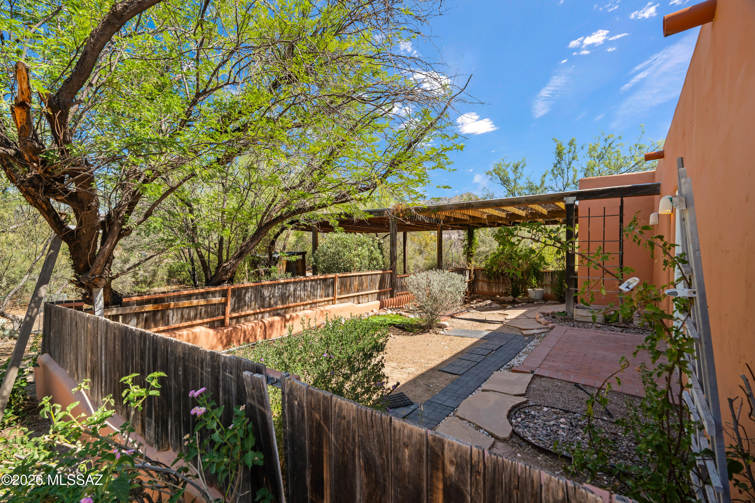 Private & secluded custom-built home in the desirable Hidden Valley area on .8 acres. Bright airy floorplan provides open comfortable living spaces. This desert gem offers 1552 Sq Ft, 3-bedroom, 2 baths with spacious living room overlooking the cozy fireplace, adjoining dining area & large picture windows with stunning mountain views. Milgard triple pane windows installed throughout in 2015-16. Saltillo tile floors throughout the house with real oak wood floors in the bedrooms. New AC, furnace, and roof in the last 10 years. Freshly painted inside and out. There is an extra tall carport to fit your RV. Walking distance to the beautiful Wes Miller park along Sabino Creek & less than 1 mile to Sabino Canyon Recreation Center. This is a must see!