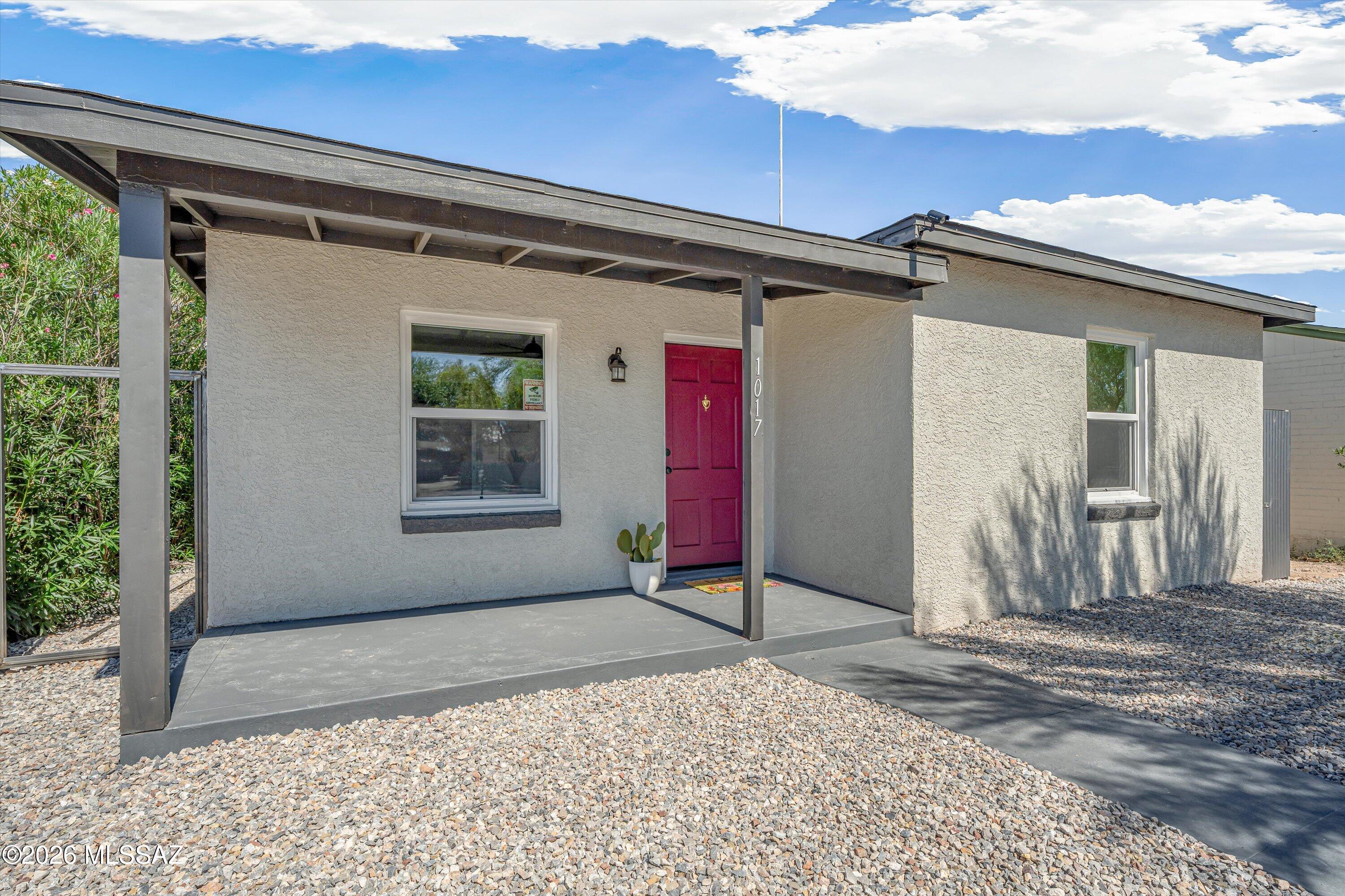 Seller offers Buyer $10,000 credit toward Buyer's closing costs!  House + Guest House just 1 mile from the U of A in desirable Historic Jefferson Park! Both homes have been completely refreshed from top to bottom and are move-in ready.  The main house offers 3 bedrooms and 1 bath with high-quality LVP flooring, new dual-pane windows, new roof, fresh interior paint, trim and baseboards throughout, plus a dedicated space for a stacked washer/dryer useable accessible by both front and back units.  Historic charm retained with wood trim at windows, original doors, built in features.  The separate guest house features 2 bedrooms and 1 bath, custom tile shower, high ceilings + it's own parking spaces. New roof, HVAC, dual pane windows and all finishes throughout both units.  A fantastic setu with plenty of flexibility--live in one and rent the other or use the guest house for extended family, or take advantage of the additional rental potential. All in a great central Tucson location close to the U of A, Banner, shopping, dining and more!