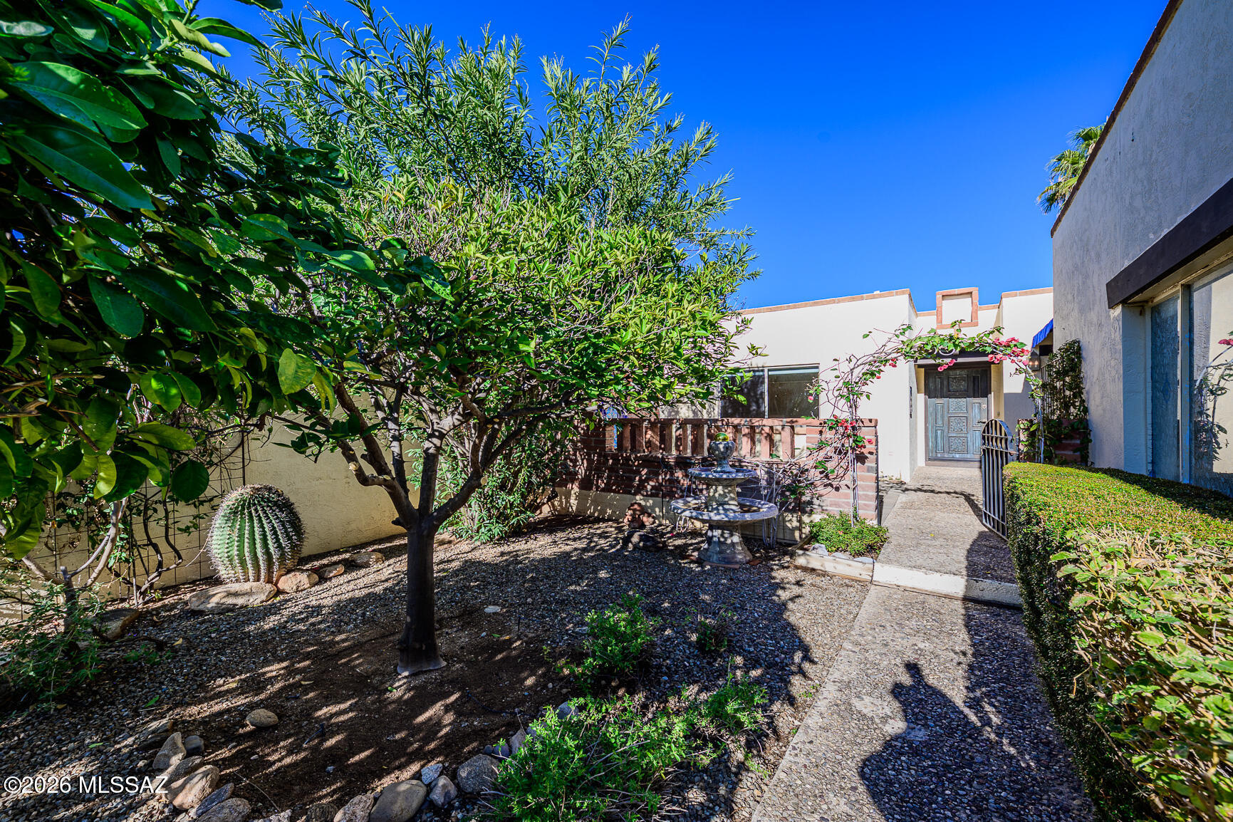 Beautifully updated 1,838 square feet, 3BR, 2BA, 2-car garage townhome in desirable Catalina Pueblo - with very close proximity to La Encantada and other shops, restaurants, and galleries at Skyline/Campbell. Just steps to one of three community pools. Upgraded kitchen and baths, floors, and interior finishes. Oversized two-car garage with ample off-street parking. Walking paths, three community pools, and a spa. LOW HOA FEES. Large courtyard entry with multiple citrus trees, & two fountains! In the backyard, you have a low-maintenance covered rear patio with a potential viewing deck and travertine paver rear yard with access to a common area for extra privacy.