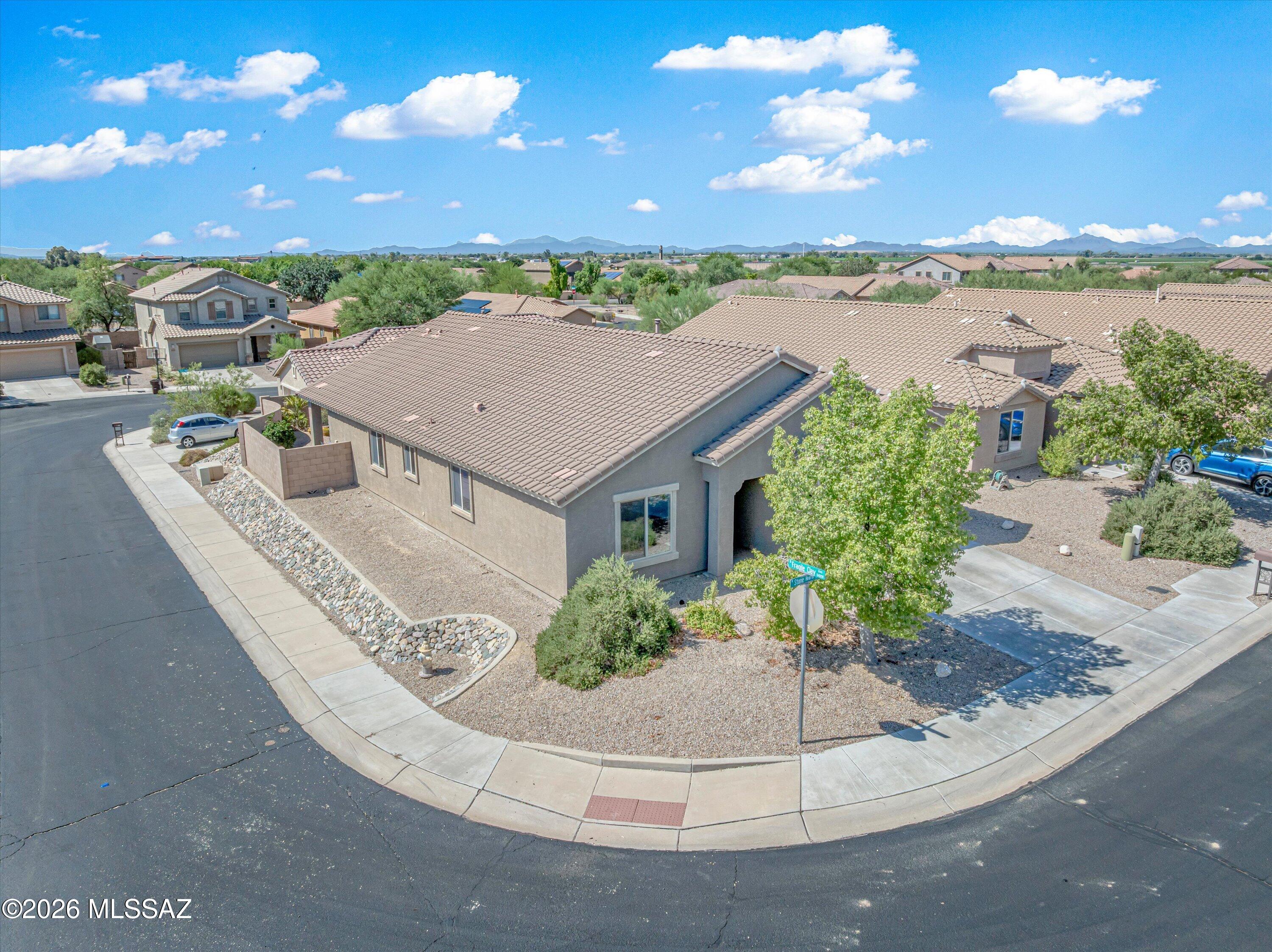 Located on a desirable corner lot, this move-in-ready, single-story home offers 3 bedrooms plus a den and 2 bathrooms with a spacious, functional floor plan. The formal living and dining area welcomes you at the front of the home, while the kitchen opens to the great room, making it easy to cook, entertain, and stay connected with guests. The kitchen features stainless steel appliances and a center island with plenty of space for gathering. Retreat to the roomy primary suite featuring a garden tub, separate shower, and extended vanity. Neutral paint throughout provides a fresh canvas for your personal style. Step outside to a landscaped backyard with paver walkways leading to a relaxing island-style seating area, creating the perfect spot to unwind or entertain. Comfortable, inviting, and