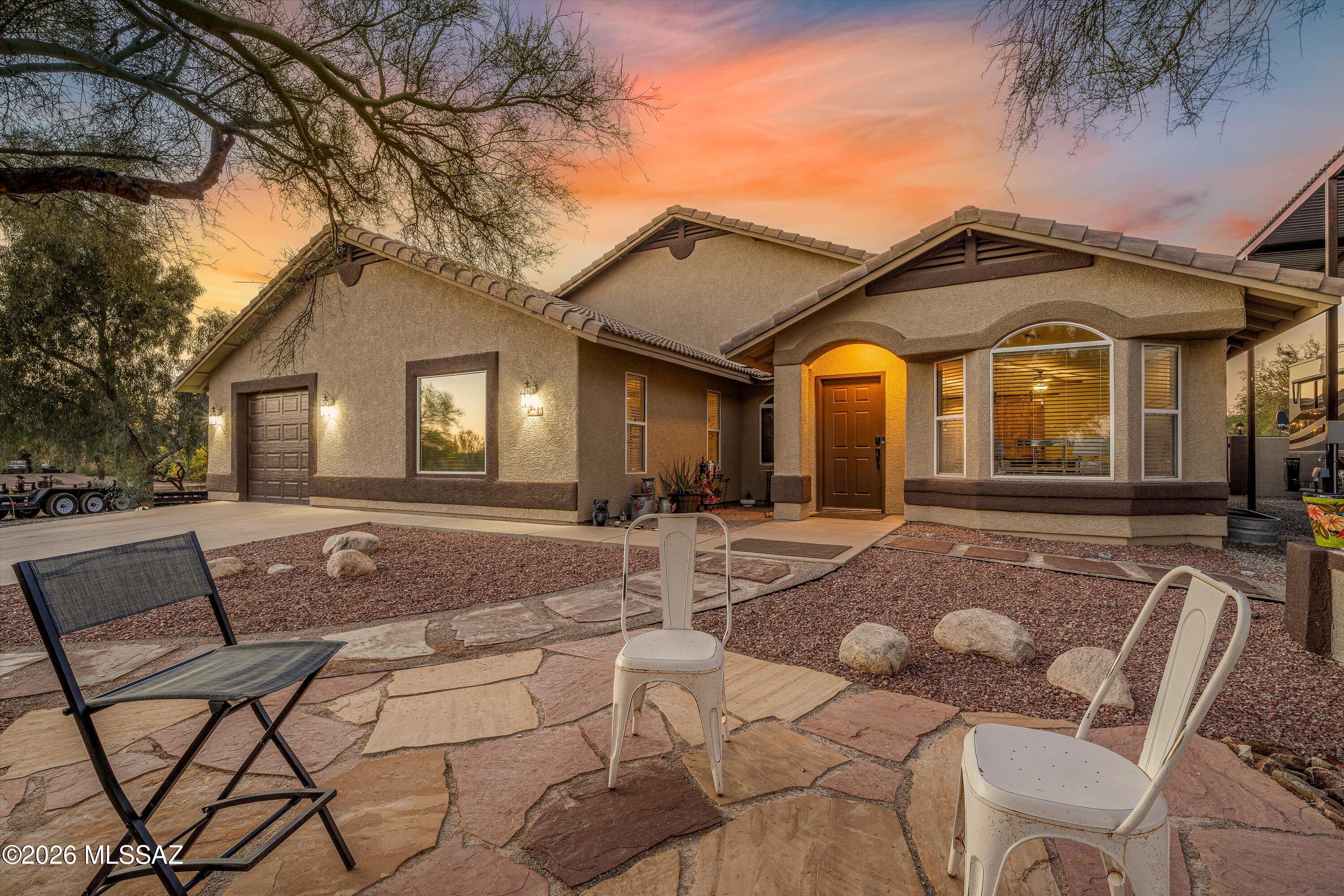Back on Market after upgrades! Rare Northwest Tucson opportunity on a spacious one-acre lot! This well-maintained 2,270 sq. ft. single-story home features 3 bedrooms, plus an office and 2 full bathrooms with a flexible floor plan designed for comfortable living and entertaining. Enjoy multiple living spaces including a formal living room, dining area, and a large family room off the kitchen. The kitchen offers a breakfast bar and cozy breakfast nook. Step outside to your private backyard retreat with a refreshing pool and expansive open space with a 30 x 50 RV parking structure, a 30 x 40 car enthusiast dream garage/workshop! Experience the freedom of wide-open desert living with beautiful views while remaining just minutes from shopping, dining, and everyday conveniences.