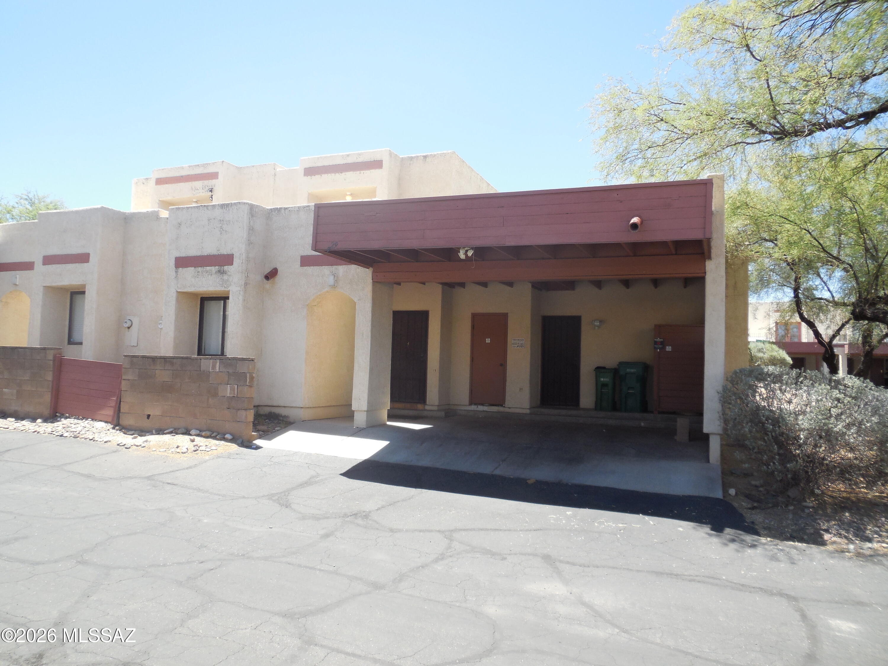 Welcome to this spacious two-story townhome located in the highly desirable Casas Adobes area within the charming Las Lomitas Townhomes community.  Offering 1551 SF of comfortable living space with new interior paint, this well-designed home combines privacy, functionality, and convenience in an ideal location. 
  The upstairs level features a private primary suite complete with its own bathroom, a dedicated space perfect for home office or computer desk and two private balconies that provide a peaceful setting to enjoy your morning coffee or evening sunset.
  Downstairs, you'll find a large living room highlighted by a cozy wood-burning fireplace, a dining area ideal for entertaining, a well-appointed kitchen, laundry area and two additional bedrooms served by a full bathroom. Step outside to a secluded, walled backyard featuring low maintenance landscaping and a built-in grill, perfect for outdoor dining and relaxing.  Additional conveniences include covered parking and storage room.
  Residents of Las Lomitas enjoy access to community amenities, including a refreshing swimming pool, all within a small, welcoming neighborhood close to everything you need.  Shopping, restaurants, entertainment, parks and everyday conveniences are just minutes away. Water is included in the HOA fee.