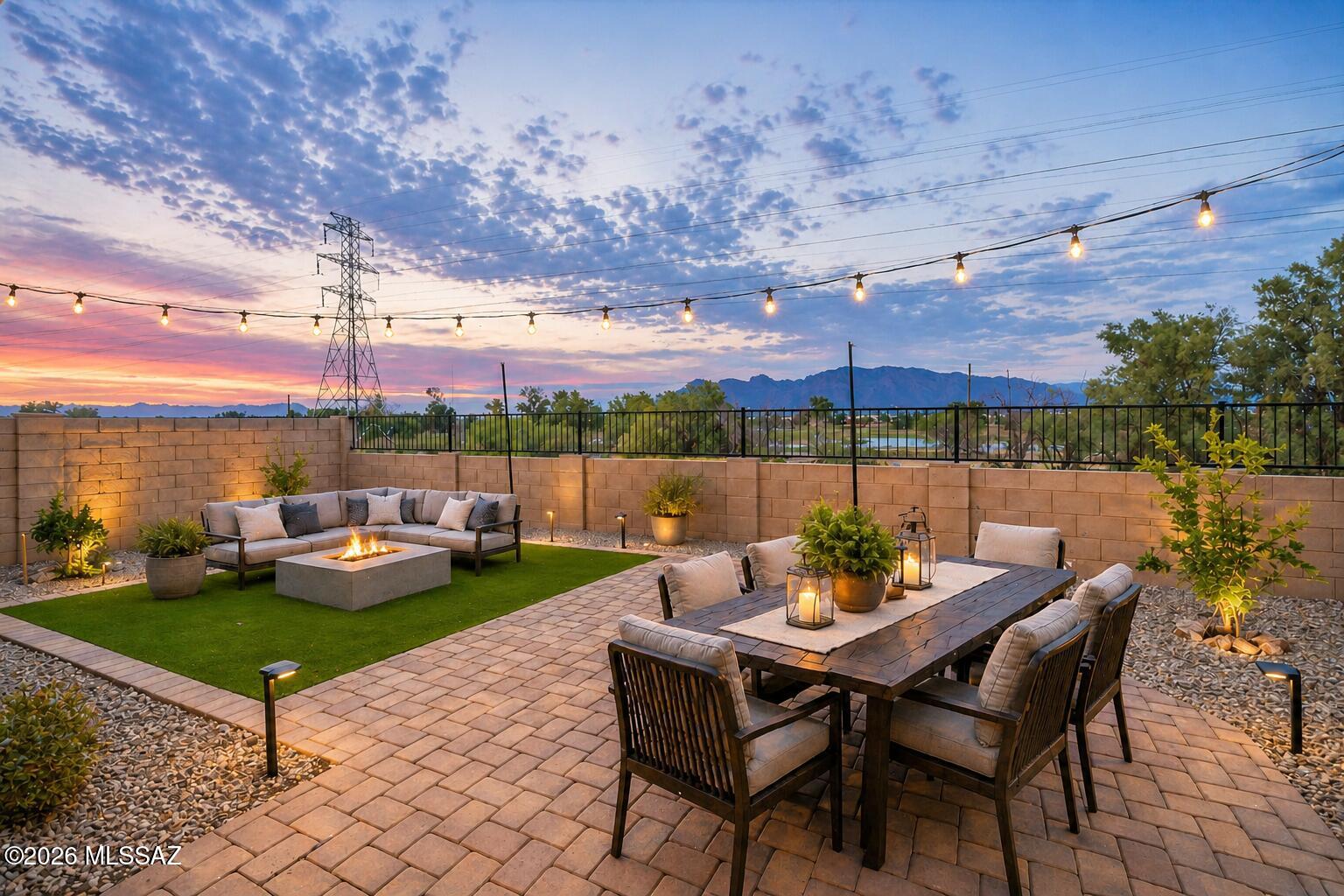 Positioned on a premium lot backing to a golf course and lake, this newer DR Horton home offers stunning mountain views and a serene backyard setting. Built in 2023, the 2,264 sq ft two-story layout features 4 bedrooms plus a loft, creating flexible living space for both everyday comfort and entertaining. The open-concept main level showcases a bright, modern kitchen with white cabinetry, stainless steel appliances, a large island, and seamless flow into the living and dining areas. Upstairs, the spacious loft provides an ideal secondary living space, while the primary suite offers a comfortable retreat. Step outside to a low-maintenance backyard with paver patio and turf, perfectly positioned to take in the golf course, water, and mountain views. A rare combination of newer construction, thoughtful design, and exceptional views in a convenient Tucson location.