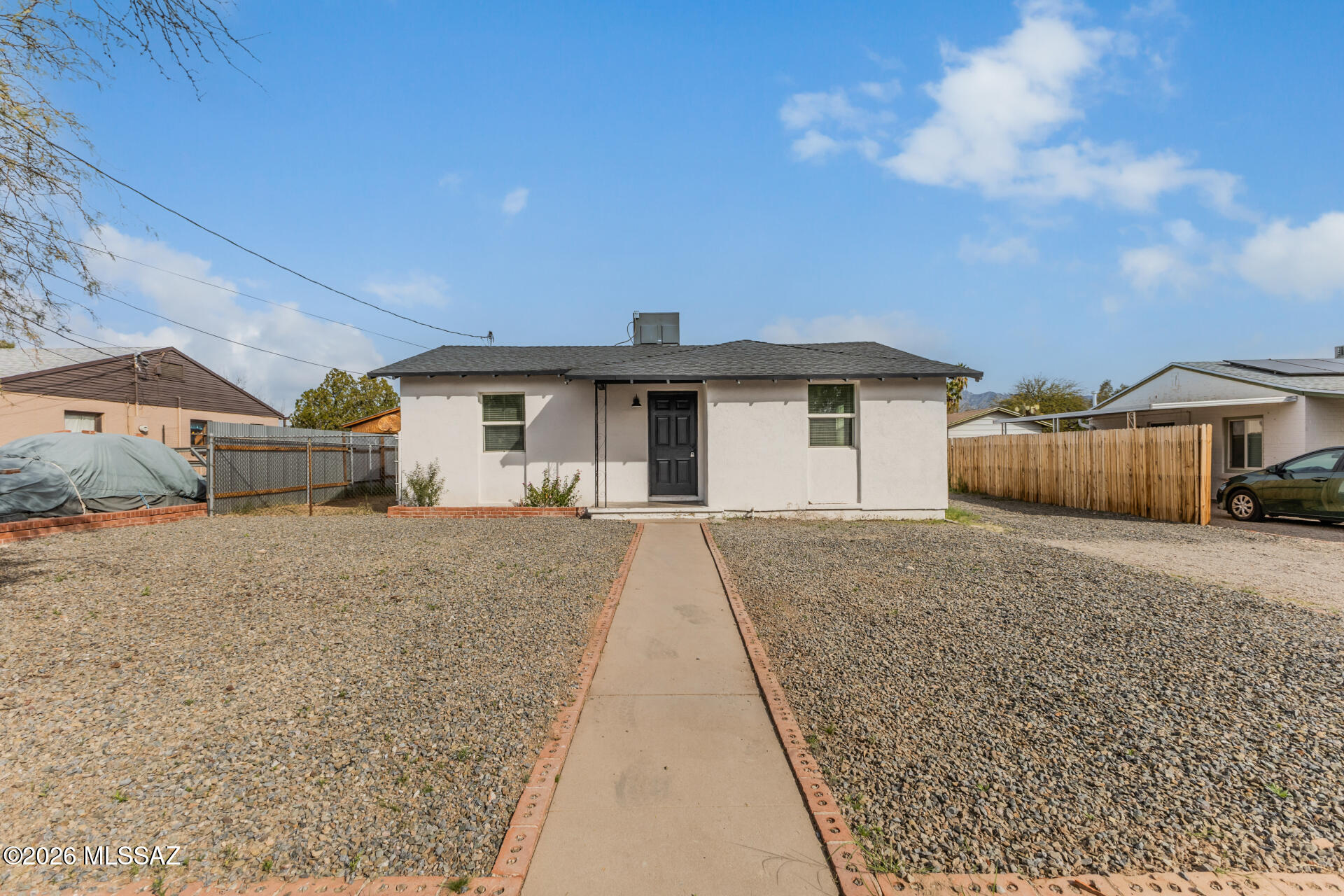 Discover this charming single-story home ready to go! You'll appreciate the tasteful interior with its  neutral paint, recessed lighting, and attractive wood-style flooring that creates a warm feel. The kitchen has stainless steel appliances, white cabinetry, and elegant quartz counters. The main bedroom features its own private bathroom for added comfort. A dedicated laundry room comes complete with a stacked washer and dryer! A fully fenced backyard is ready for your personal touch. With alley access and beautiful mountain views, this gem is for you! Guest House offers 480 sqft and currently leased until end of April.