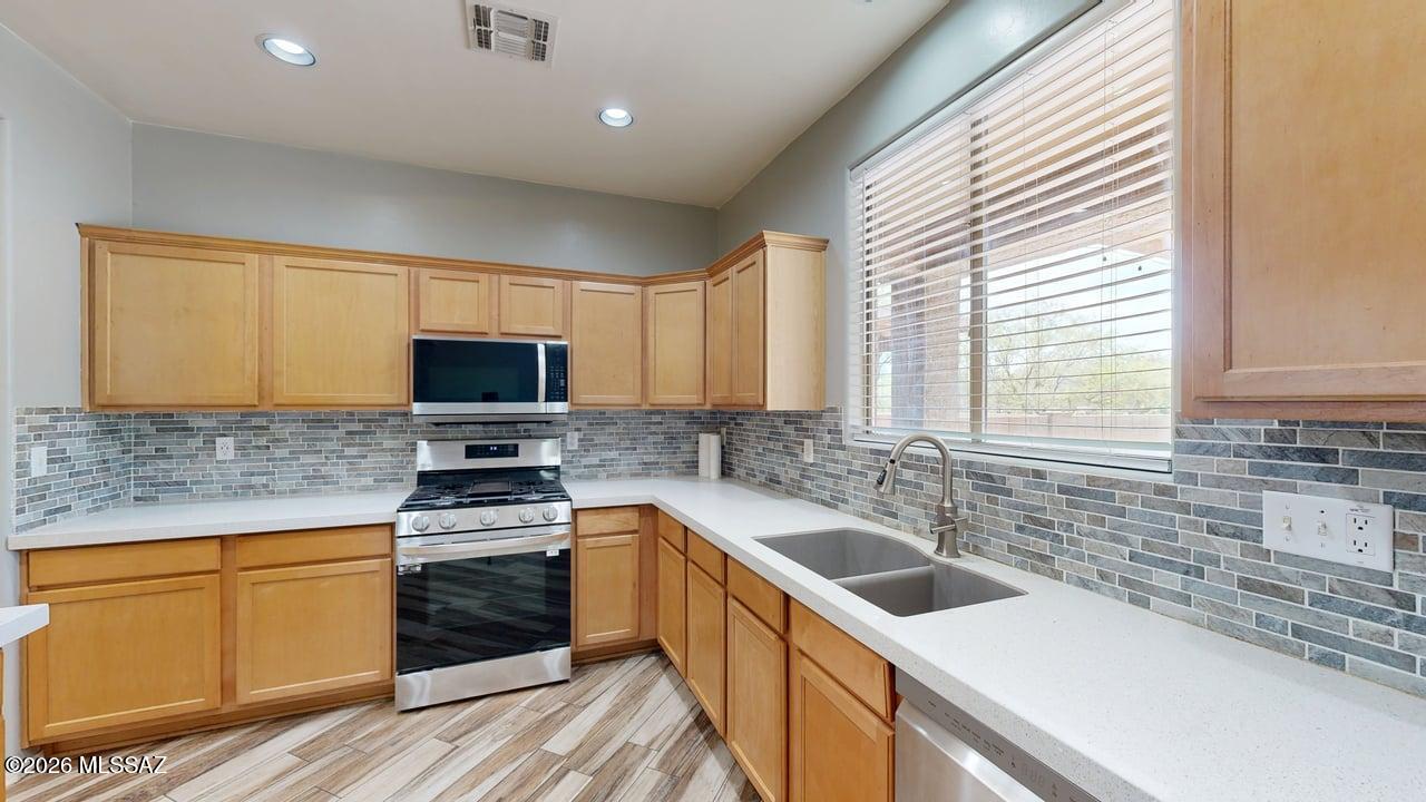 Agent/Owner. Original owner. This spacious 5-bedroom home features two primary suites and 3.5 bathrooms, offering exceptional flexibility for multi-generational living or guests. The downstairs showcases wood-look ceramic plank flooring, while the upstairs features luxury vinyl plank flooring. The staircase has been upgraded with stained oak treads and crisp white risers, adding a custom touch.

Major improvements include newer A/C and heating, recent exterior paint, and a permitted 30' x 13' covered back patio with paver flooring--perfect for outdoor entertaining. Enjoy added privacy with no rear neighbors, as the home backs to a neighborhood park.

Additional highlights include a 2-car garage, two-year-old kitchen appliances, and a water softener system. Home qualifies for Hoper Prog