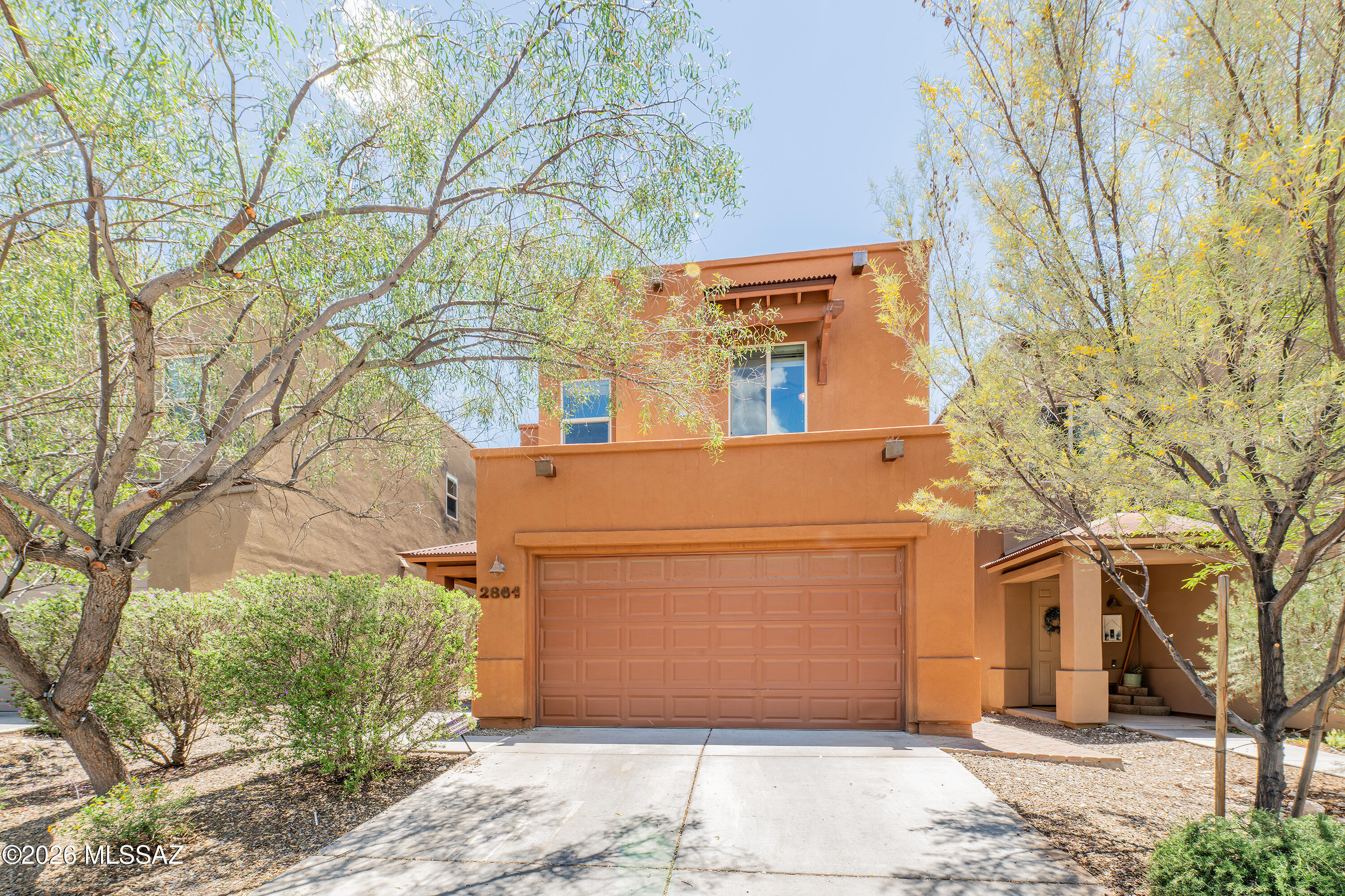 Seller will accept or counter offers between $399,000 and $409,000.  One of the most desirable floorplans built by Miramonte Homes in this community! The spacious downstairs layout features a large kitchen with bar seating, pantry, dining area, great room, powder room, and sliding glass door leading to the covered patio. Upstairs offers an oversized primary suite with room for a king-size bed and nightstands, dual sinks, large walk-in closet, two additional bedrooms, full hall bathroom, and convenient upstairs laundry room. The low-maintenance backyard includes a covered patio, pavers, and artificial turf. Ideally located just one block from Mountain Ave and minutes from the University of Arizona, grocery stores, restaurants, shopping, and more.