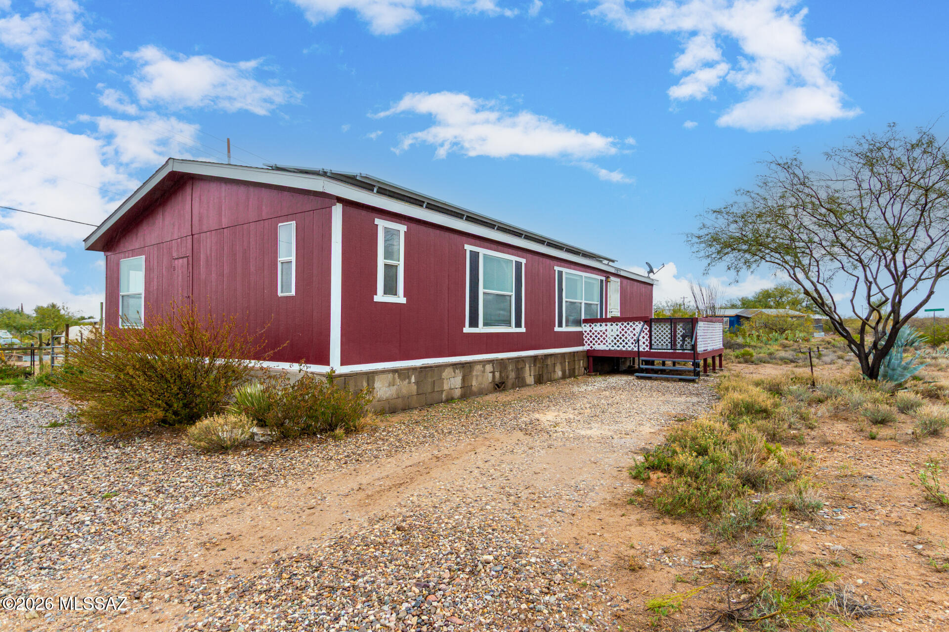 Looking for your own homestead nestled on a 1-acre lot? You will be greeted by a welcoming front porch, perfect for soaking up the Arizona sun and the inviting living room flows seamlessly into the dining area, making entertaining a bliss. You'll like the wood-look flooring, neutral palette, lots of natural light, mountain views and vaulted ceilings that enhance the spacious, airy feel. The kitchen comes with honey oak cabinets, matching appliances, a center island, and a breakfast bar. Don't miss the cozy breakfast nook ideal for morning coffee. Main bedroom includes a private bathroom with dual sinks, and a soaking tub. The expansive backyard has enough room multiple garden beds, green houses and all your toys - bonus of OWNED SOLAR!