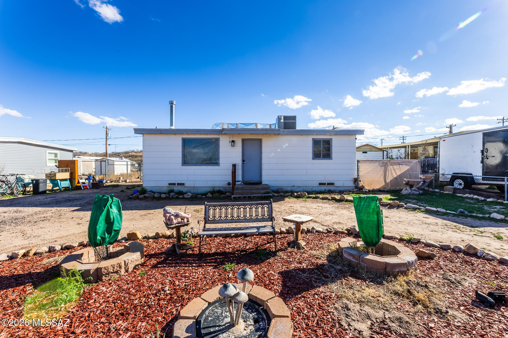 This charming 2 bedroom 1 bathroom home sits on a nice sized lot. Inside you will find a combination of laminate flooring and carpet as well as a refreshed bathroom that gives the home a modern touch while maintaining its character. The wood-burning stove creates a cozy focal point for relaxing evenings and the newer air conditioning keeps things comfortable year round. A wonderful blend of charm, comfort and space! Roof was recently recoated and new wood flooring placed in the entry way. Home is sold ''as-is''
