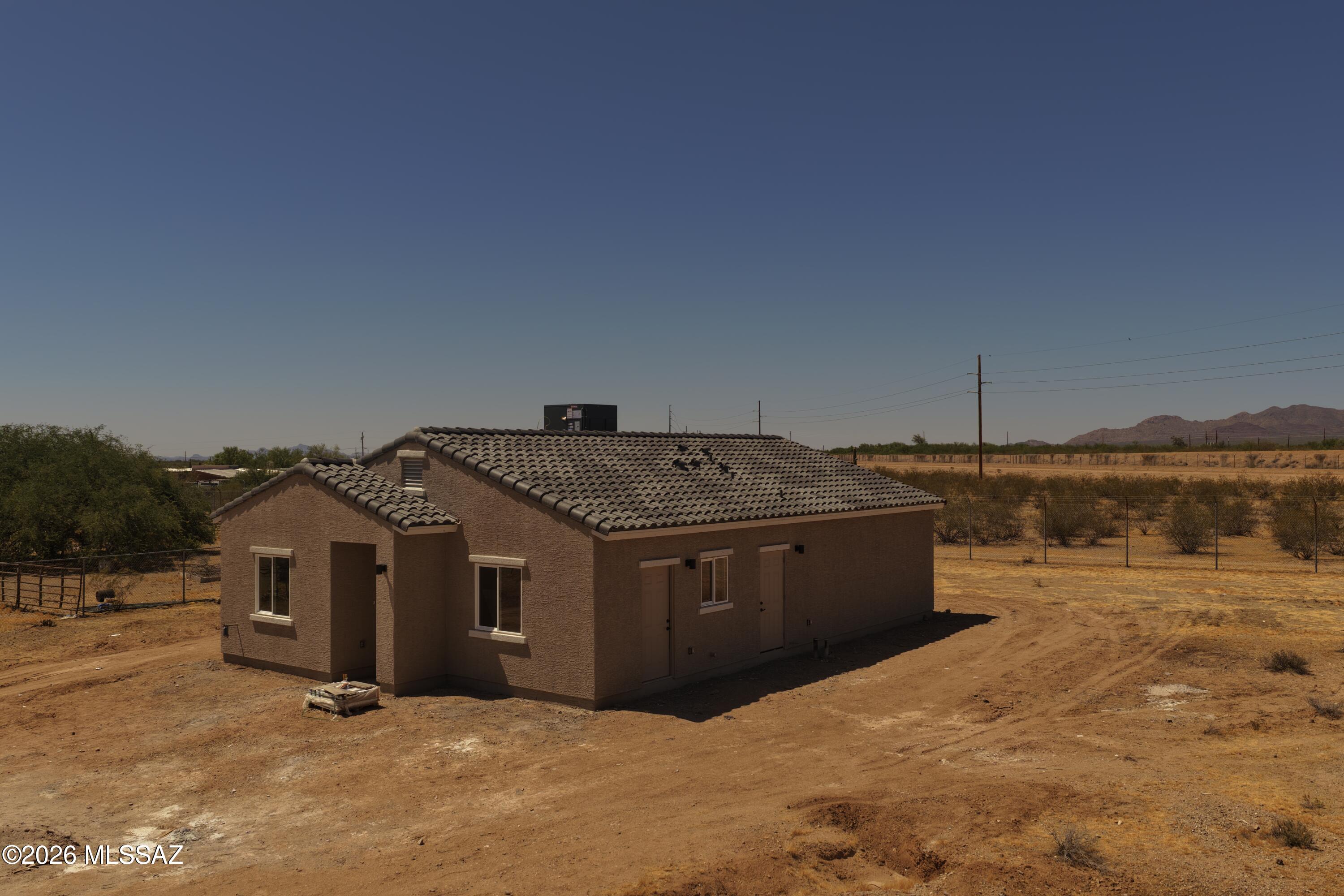 New construction on nearly an acre! This beautiful 3-bedroom, 2-bath home sits on 0.9 of an acre and offers the perfect blend of peaceful country living and modern comfort. Featuring its own private water well and plenty of space for horses, this property is ideal for anyone looking to enjoy the outskirts of Tucson with room to grow. Enjoy stunning desert surroundings, open space, and the opportunity to make this brand-new home your own. Ready for its new owner,