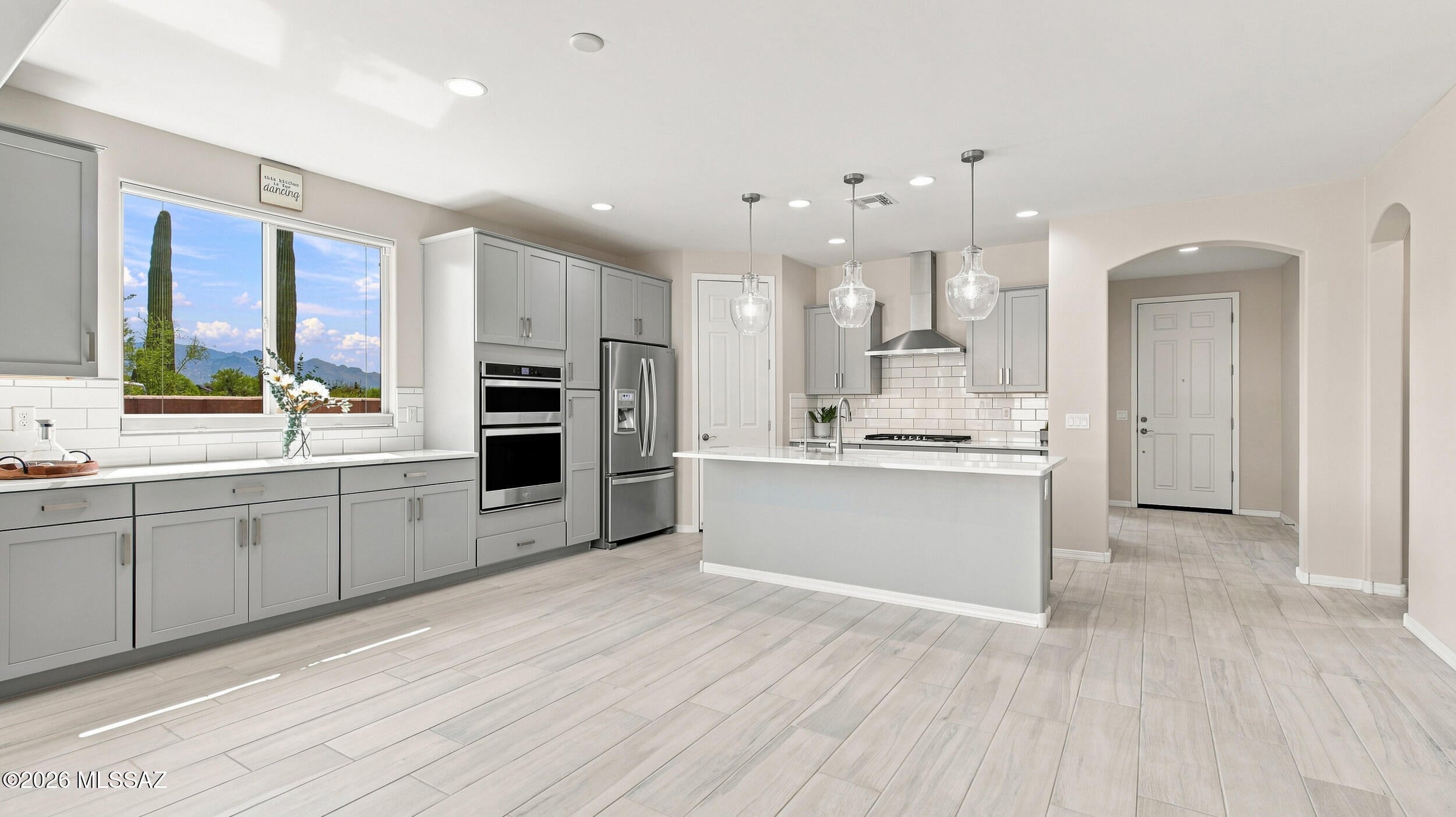 WOW! Immaculately maintained, OWNED SOLAR and outrageously upgraded! This 3BD/2BA + den/flex space offers exceptional privacy with no immediate neighbors to the front, rear or one side, plus majestic views of the Tortolita and Catalina Mountain ridges in the desirable gated community of Tangerine Ridge.

The jaw dropping gourmet kitchen includes stainless steel appliances, extended cabinetry, quartz countertops, built-in buffet, spice cabinet, large pantry, and stylish LED pendant lighting. The spacious primary suite features a bay window, dedicated mini-split for personalized comfort, barn door, dual sinks, and upgraded walk-in shower.

Energy-conscious improvements include an OWNED 11.4kW solar system installed in 2021, Rheem tankless water heater, Ecobee dual-zone thermostat sensor insulated garage door, upgraded window treatments, ceiling fans and LED lighting. Smart-home conveniences include fiber internet, Ring doorbell, and WiFi irrigation controller. Water softener/conditioner and reverse osmosis system add everyday convenience.

ALL APPLIANCES INCLUDED, including LG washer/dryer and extra garage refrigerator! The laundry room offers a utility sink and generous cabinetry, while the TANDEM 2.5 car garage features SafeRack overhead storage and EV-charging capability.

Step outside to a low-maintenance backyard with artificial turf, extensive pavers, natural gas BBQ plumbing and a desirable NE-facing covered patio--perfect for entertaining, relaxing and enjoying Arizona outdoor living.

This property is an exceptional combination of PRIVACY, MOUNTAIN VIEWS, ENERGY EFFICIENCY and true PRIDE OF OWNERSHIP. Prime location with easy access to I-10 & all that Oro Valley & Marana offers: shopping, dining, parks, bike path, outdoor recreation & more. Schedule your showing today!