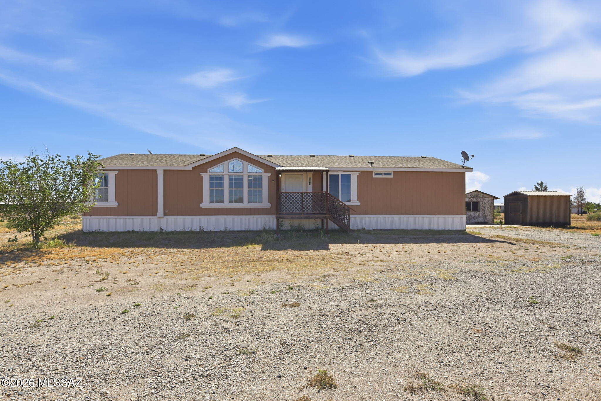 Welcome to 864 N Taylor Rd in Willcox, AZ, a property filled with potential, beautiful mountain views, and usable land ready for your vision. Seller is offering up to $10,000 in concessions for updates, creating a great opportunity to add your own personal touches and customization. The roof was replaced approximately 5 years ago, freshly painted exterior finishes, some newer skirting, and a private well with an exterior replaceable filter. Conveniently located off the main road, the property also includes a separate workshop/shed, additional storage shed, and a spacious rear concrete slab perfect for relaxing or entertaining outdoors. Offering space, flexibility, and thoughtful features throughout, this Southern Arizona property is ready for its next chapter.