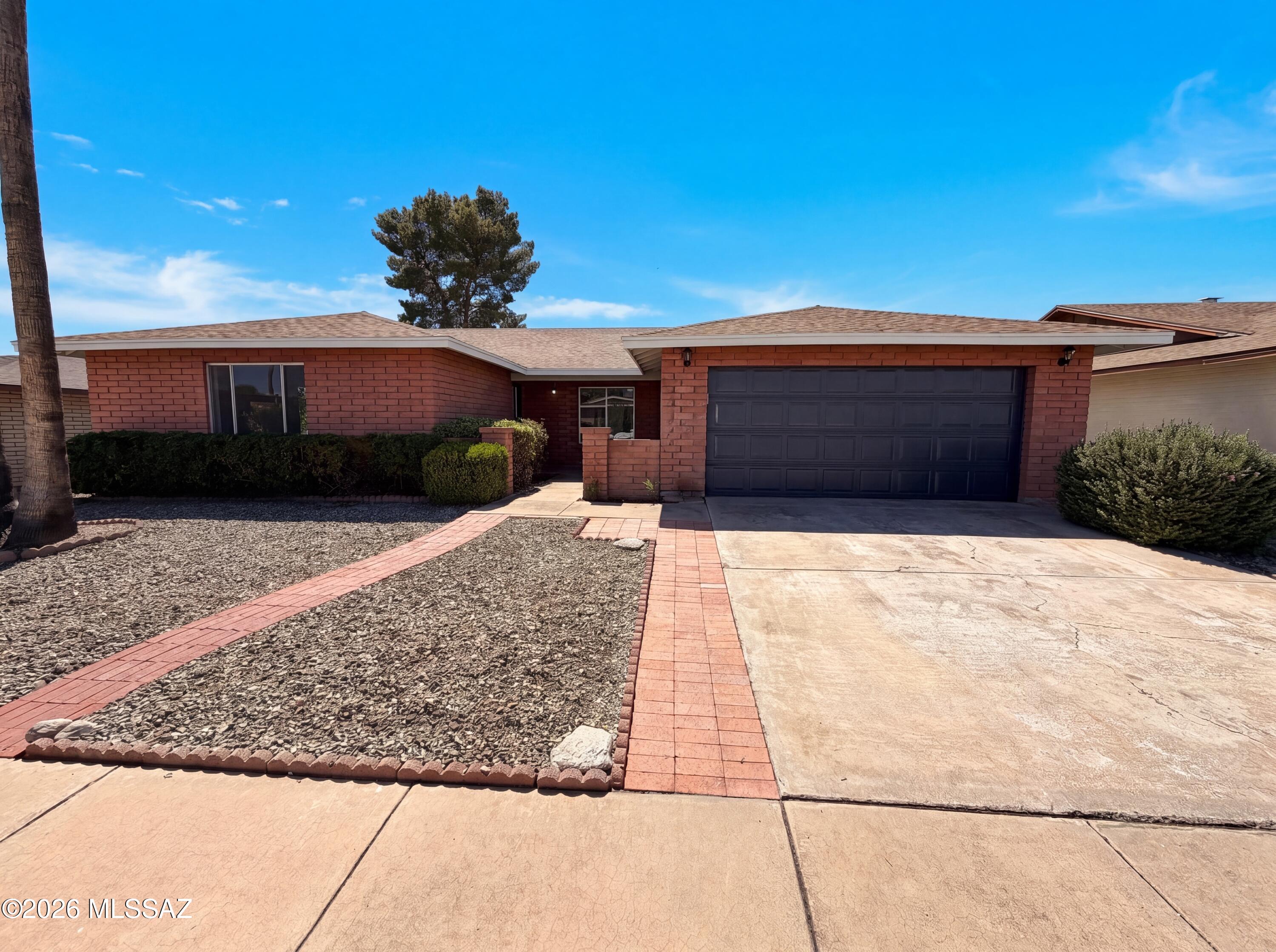 Step into 1610 S Burning Tree Ave, a fully updated residence with fresh interior paint and new flooring throughout. The kitchen features new all stainless steel appliances, while a fireplace adds warmth. Double closets in the primary bedroom provide organized storage. The primary bathroom features double sinks, creating ease for morning. A covered patio overlooks the fenced-in backyard, all complemented by fresh exterior paint. A must-see for updated comfort and outdoor appeal. Included 100-Day Home Warranty with buyer activation