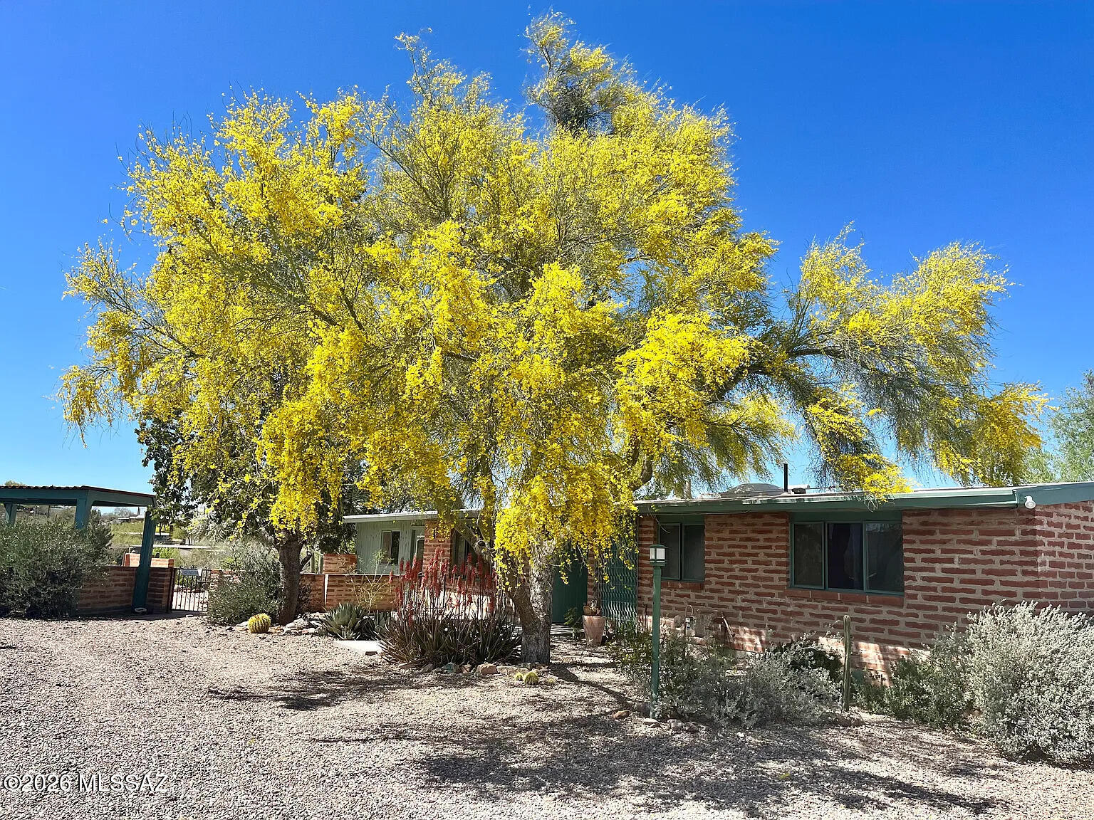 Tom Gist for rent! Mid century burnt adobe brick home featuring 3 bedrooms, 2 bathrooms. Kidney shaped pool in back yard w/ spectacular sweeping 360 degree mountain views. Kitchen and both bathrooms were recently renovated. Concrete flooring throughout. Quartz countertops + high-end fixtures throughout. Primary suite has separate entrance off flagstone patio with an additional outdoor kitchen. Primary bath leads to pool with an additional outdoor shower and lush desert surroundings. Central air HVAC and gas furnace and range. Sweetwater Reserve circuit is just down the road with horse back riding, mountain biking & hiking. K-8 schools 10 min walk, drive 10 min. to I-10 PCCC, 15 min. to downtown and U of A. Tenant pays monthly utils: electric, water, gas, trash, wifi + $150/mo pool maint.