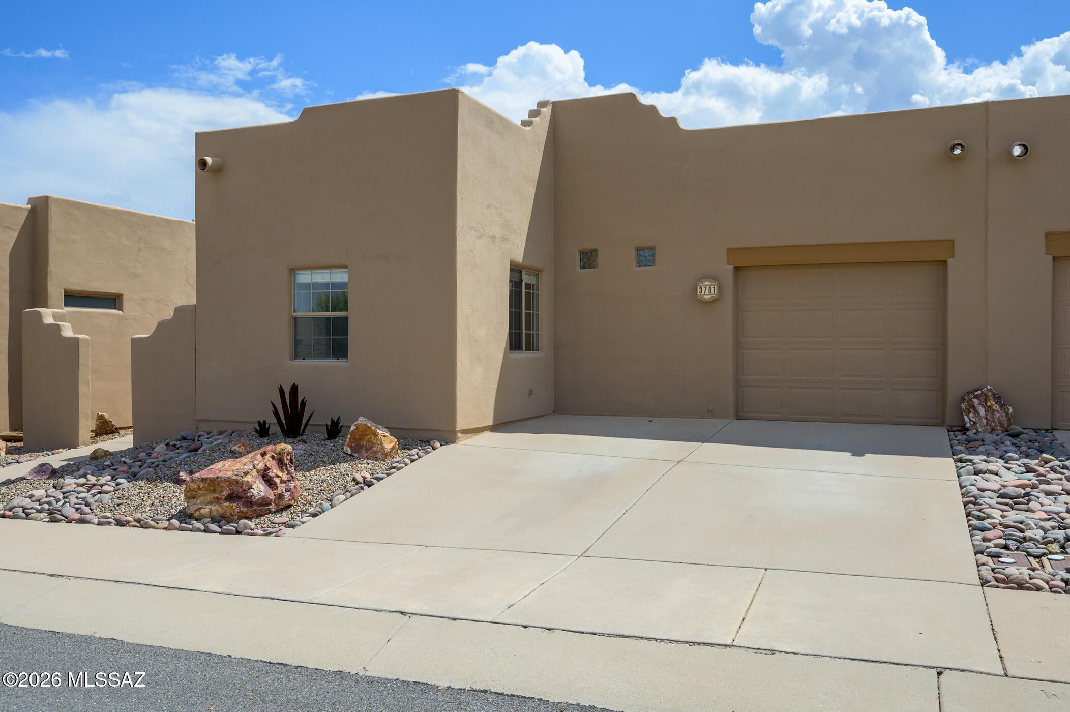 Enjoy effortless Green Valley living in this inviting 2-bedroom, 2-bath townhome located in the highly desirable community of The Springs. Offering 1,108 sq. ft. of thoughtfully designed living space, the home features a bright, open layout where the kitchen flows seamlessly into the main living area, creating a comfortable setting for everyday living and entertaining. Easy-care solid-surface flooring runs throughout, while a versatile office provides the perfect space for working from home, hobbies, or a quiet retreat. An attached 1-car garage provides convenient parking and additional storage. Step outside and enjoy the welcoming neighborhood atmosphere, with attractive common areas, sidewalks throughout the community, and beautiful Santa Rita Mountain views adding to the Southern Arizona setting. Just moments away, the Santa Rita Springs GVR Center offers convenient access to recreation, activities, and social opportunities.With an HVAC system replaced in 2021 and the roof recoated within the last few years, this home offers added peace of mind. Whether you're searching for a full-time residence, winter getaway, or low-maintenance Green Valley retreat, this wonderful property is ready to enjoy. Don't miss the opportunity to make it yours!