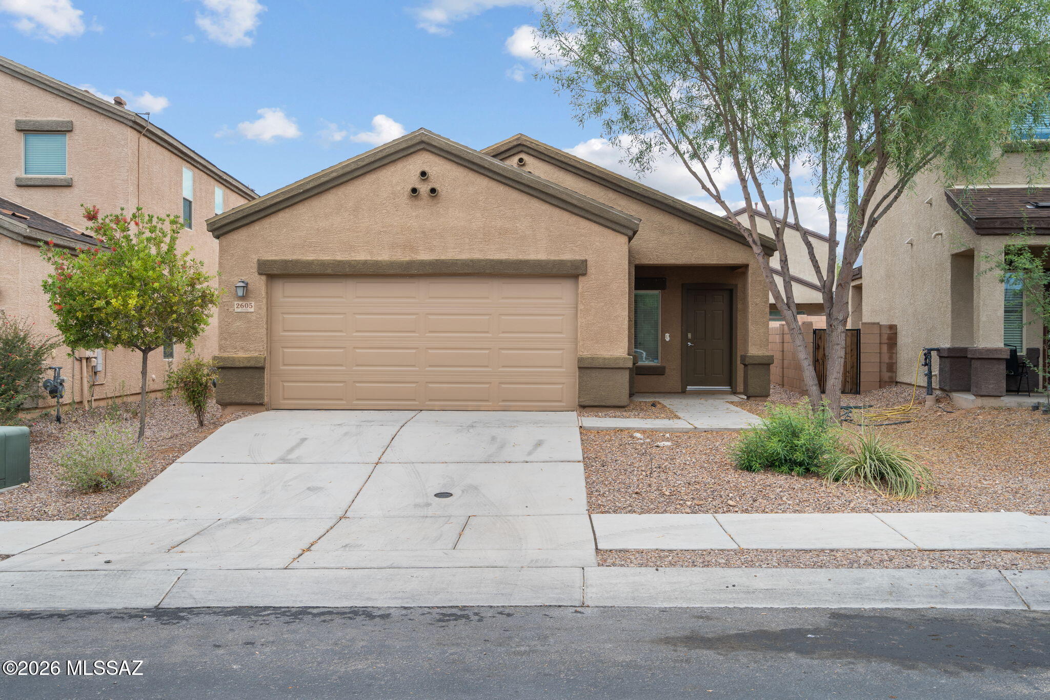 Built in 2020, this move-in ready 3-bedroom, 2-bath home in Tres Pueblos Este offers 1,334 sq. ft. of comfortable living with modern finishes throughout. The kitchen features granite countertops, stainless steel appliances, and all appliances convey. Tile flooring runs through the kitchen, bathrooms, and hallway, with carpet in the bedrooms for added comfort. The primary suite includes a walk-in closet and dual vanity. Enjoy a covered patio overlooking a low-maintenance backyard with mature landscaping. The community offers a playground with covered picnic area and grill. Conveniently located near shopping, restaurants, and major commuter routes, this home offers the perfect blend of comfort, convenience, and low-maintenance living.