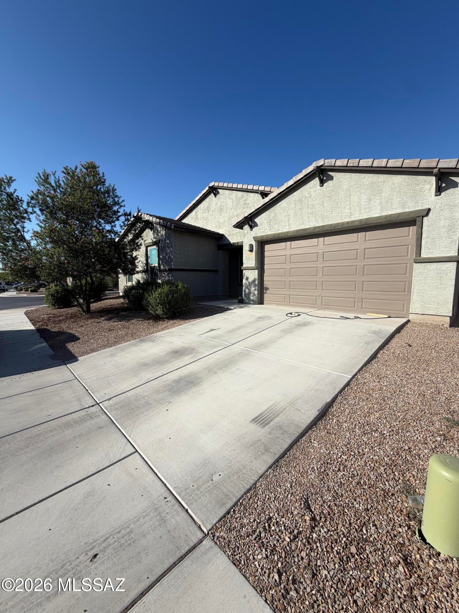 Welcome to this stunning 4-bedroom, 4-bath home, thoughtfully designed with upgrades, comfort, and entertaining in mind! The spacious kitchen features granite countertops, double ovens, ample cabinetry, and plenty of room to gather. Relax in the cozy living room featuring an electric fireplace, perfect for relaxing evenings. The upgraded kids' rooms offer built-in loft beds, creating fun and functional spaces for the whole family. The spacious dining area is perfect for family dinners, entertaining, or game nights. The garage features a beautiful blue epoxy floor, adding style and durability. Pet lovers will appreciate the built-in dog washing station conveniently located in the laundry room! With so many thoughtful features throughout, this home truly has something for everyone.