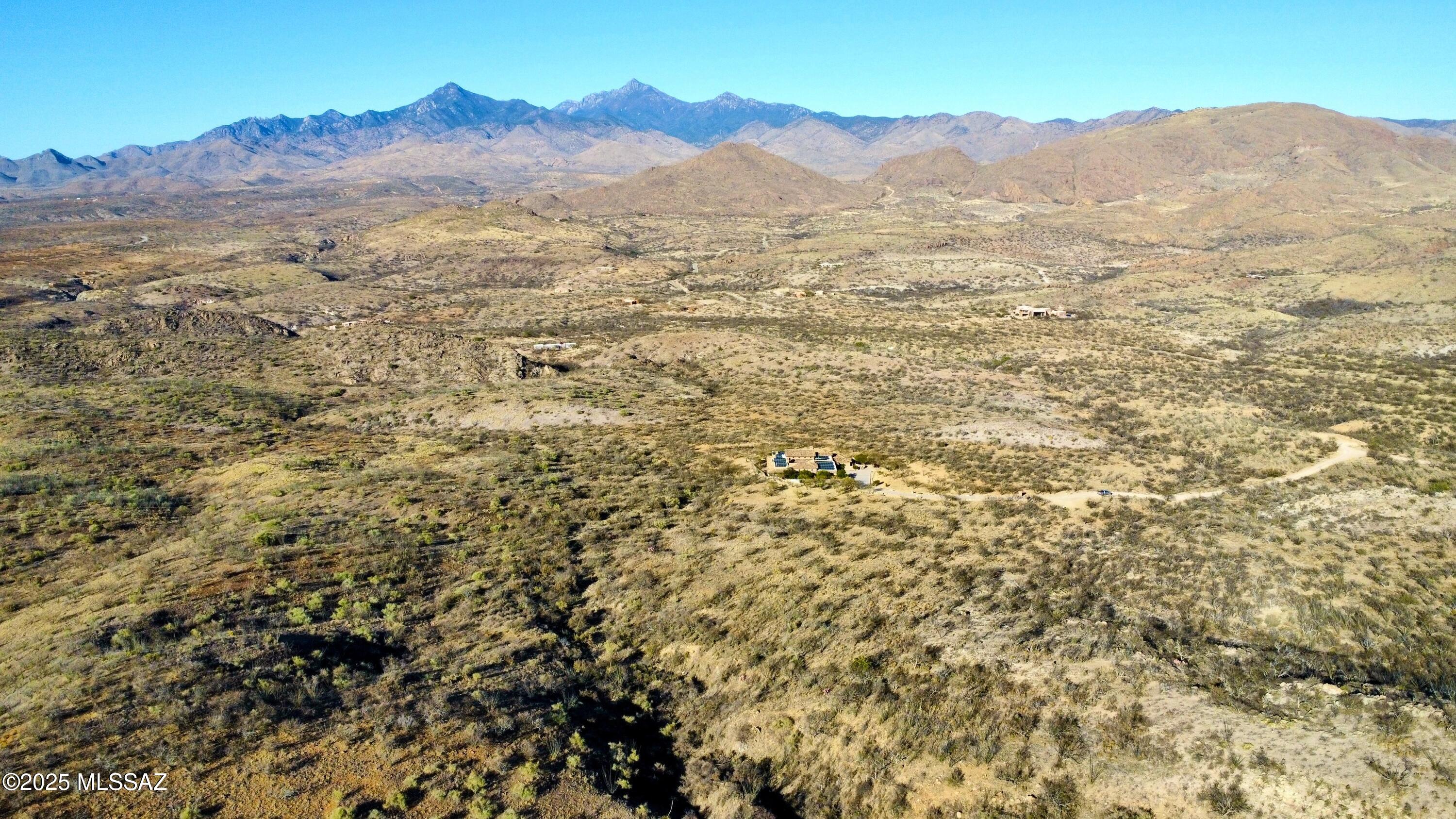 Nestled within the prestigious Morning Star Ranch, this remarkable 38-acre parcel captures the essence of Arizona's most awe-inspiring landscapes. Positioned to take full advantage of its high-desert setting, the property offers sweeping, unobstructed panoramic views in every direction. Gaze across the dramatic Santa Rita Mountains, follow the ridgelines north toward Green Valley, and admire the distant silhouettes of Mexico's Santa Barbara Mountains--all while being cradled by the rugged, timeless beauty of the San Cayetano Range. With its extraordinary vistas, serene privacy, and generous acreage, this exceptional homesite presents a rare opportunity to craft a dream estate in one of Southern Arizona's most breathtaking natural environments. With multiple prime building sites, you can craft a custom retreat that takes full advantage of the picturesque surroundings. Enjoy the tranquility of nature, far from the noise and congestion of city life, where the air is crisp, the skies are vast, and the only sounds you'll hear are the whispers of the wind and the melodies of desert wildlife.
The well-managed HOA ensures meticulously maintained common areas and roads, along with convenient garbage disposal services. Water is readily available through Liberty Utilities, or for those seeking a more self-sufficient, off-grid lifestyle, you have the option to dig your own well.
Whether you're looking for a peaceful getaway or a forever home in nature's embrace, this lot is an ex-traordinary canvas for your vision. Come experience the serene beauty and boundless possibilities that await in Morning Star Rancha truly exceptional place to call home.