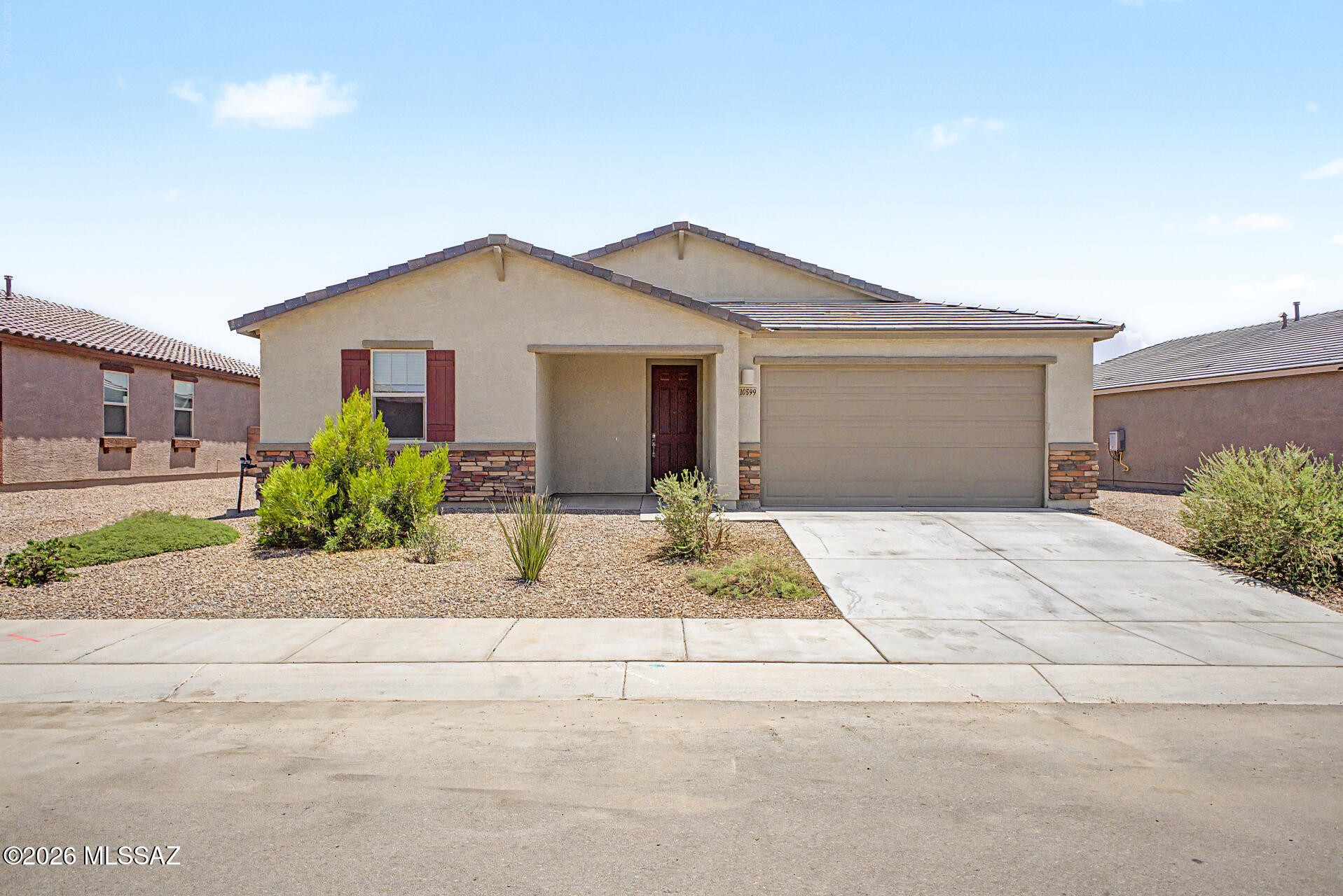 Lightly lived in, this highly sought after Odyssey floor plan offers 4 bedrooms, a desirable split layout, and a spacious 3 car garage with epoxy flooring. The open concept kitchen features ample cabinet space and flows seamlessly into the living and dining areas, making it perfect for both entertaining and everyday living. Step outside to a low maintenance backyard, featuring a large artificial turf area and an extended concrete patio for outdoor gatherings or simply relaxing. Fully landscaped and move-in ready, this home offers all the benefits of new construction without the added expense or wait. Plus, qualified buyers may take advantage of an assumable loan with an attractive 4.75% interest rate.