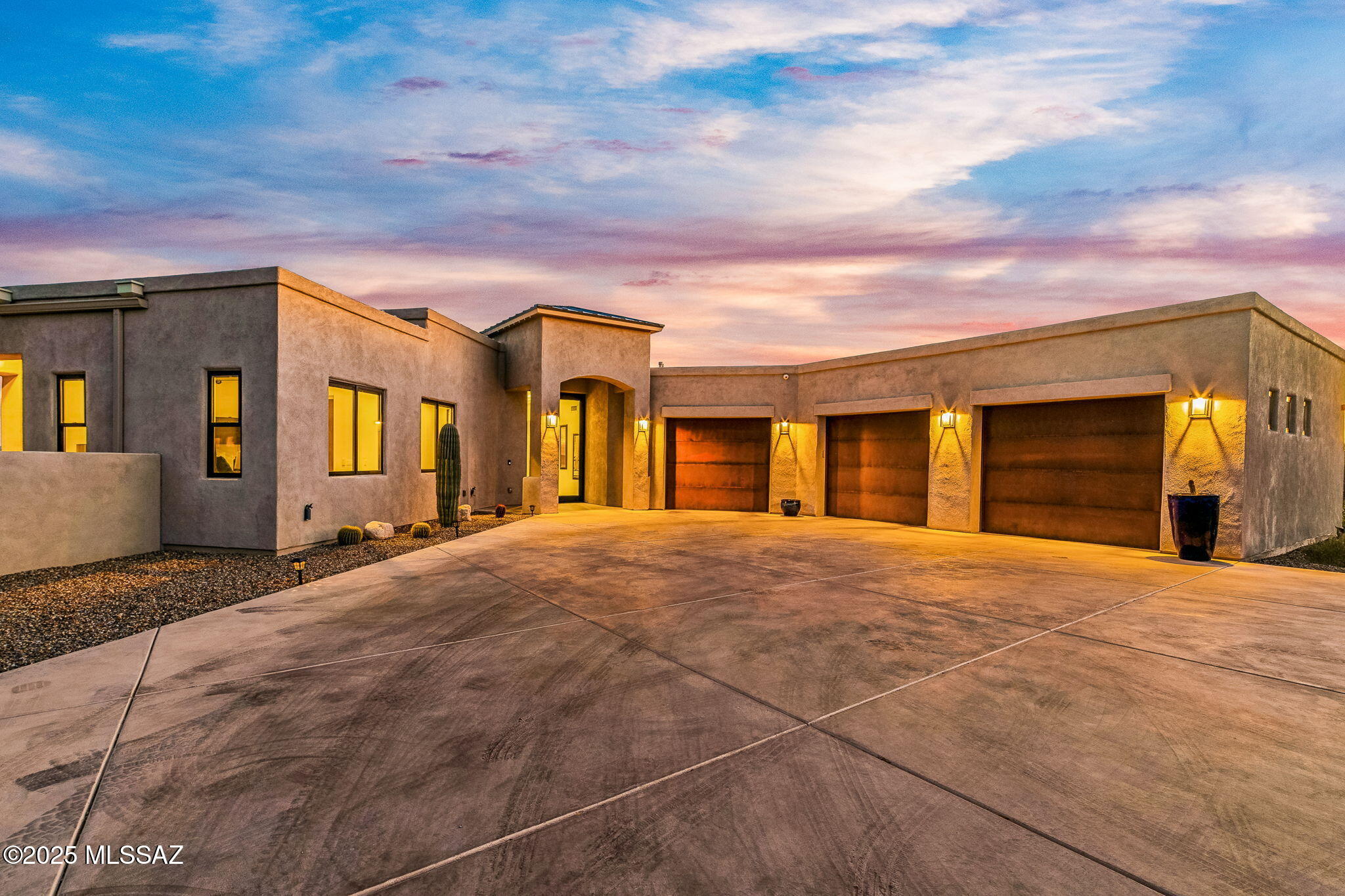 Welcome to a singular expression of refined desert living—an architecturally stunning custom estate nestled on over six private acres in coveted Oro Valley. From the moment you arrive, the home exudes elegance and exclusivity, beginning with a meticulously designed paver-lined entry that sets a grand stage leading up to the dramatic 10-foot cantilevered glass front door!

Step inside and immerse yourself in an ambiance curated for luxury and leisure. This intelligently designed split-floor plan offers generous proportions and sophisticated functionality!

At the center of the home lies a chef's dream kitchendesigned to inspire culinary excellence and effortless entertaining. Featuring dual ovens, dual sinks, a pot filler, quartz countertops, high-end appliances, a walk-in pantry, and views of pristine mountain and city light views as you create memorable meals. This epicureans delight overlooks the great room, backyard, and deep covered patio creating a sense of connection to all!

The luxury continues. The main living area features a striking beam ceilings and a gas fireplace, seamlessly connecting all the spaces with warmth and comfort. The primary suite is a true retreat with flex space, fireplace, a spa like bathroom adorned in quartz with steam shower, and even automated blinds allowing you to awaken each day to breathtaking vistas of the Catalina Mountains!

Indulge the resort style backyard with a state-of-the-art VSSL surround sound system, perfect for setting the tone as you unwind in the spa or take a sunset swim in the tranquil pool. Entertain family and friends beneath an oversized, deep covered patio ideal for al fresco dining and outdoor media experiencesall while enveloped in the serenity of the desert landscape!

Even more, the guest suites are generously sized and include spacious walk in closets. Also, this home boasts a private guest quarters with en-suite bathroom thoughtfully positioned for privacy and direct access to the expansive back patioframing unobstructed views!

Every element of this residence reflects thoughtful craftsmanship: soft-close cabinetry and drawers throughout, 8-foot solid wood doors, skylights strategically placed for optimal natural light, and interior surround sound in every major room. The oversized laundry suite even boasts quartz countertops, a built-in ironing station, and utility sinkblending beauty with purpose.

Additional highlights include:

- Private fitness studio with independent climate control
- Long Paver Driveway
- Jack & Jill bedrooms with remote-controlled blinds and individual vanities
- Dedicated home office with sunset views
- Temperature-controlled wine closet for the discerning collector
- Central vacuum system indoors and in the garage
- Ceiling fans in every room, including patio spaces

This is more than a homeit is a rare fusion of modern luxury and desert serenity, just moments from premier dining and shopping. A true private retreat that offers the best of both worlds: absolute seclusion with urban convenience!

Opportunities like this are few and far between. Schedule your private showing todaythis desert masterpiece will not remain available for long!