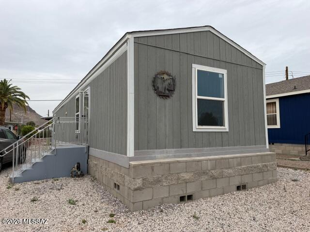 Discover easy, affordable living in this 2023 manufactured home located in the desirable active adult Tucson Estates community. This inviting 2 bedroom home features luxury vinyl flooring throughout, a functional kitchen with electric range, refrigerator and lots of cabinets.  Enjoy a split bedroom layout, in home laundry, central AC, and low-maintenance desert landscaping. The community offers an exceptional lifestyle with pickleball, tennis, pool, spa, golf, recreation rooms, parks, and walking trails. Perfect for those seeking comfort, convenience, and vibrant amenities in a welcoming 55+ setting.