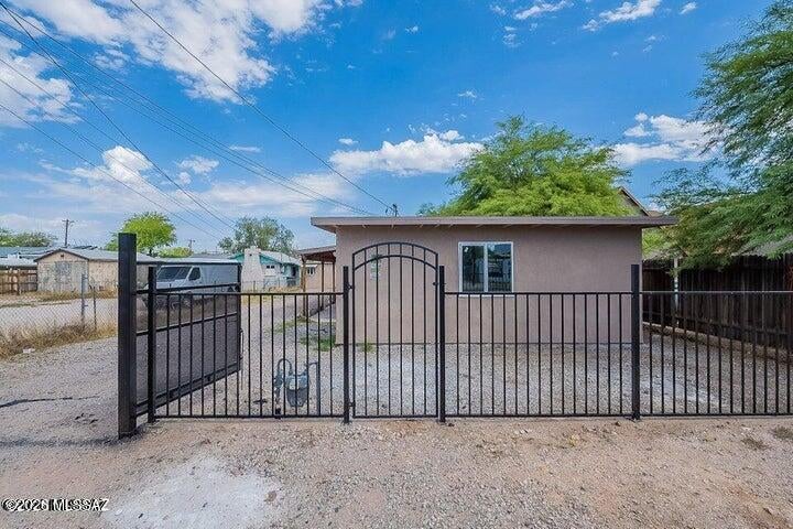 Turnkey duplex, remodeled in 2023! Two separate 3BR/1BA homes on one lot, each with updated kitchen, remodeled bath, laminate flooring, private yard, separate parking & separate electric meters. Both units leased ($1,744 + $1,250) = $2,994/mo combined. The back unit lease is month-to-month. The front unit lease expires on March 31, 2027. Minutes to downtown Tucson, freeway, dining & shopping. Ideal for investors or owner-occupant. Don't miss this cash-flowing opportunity!