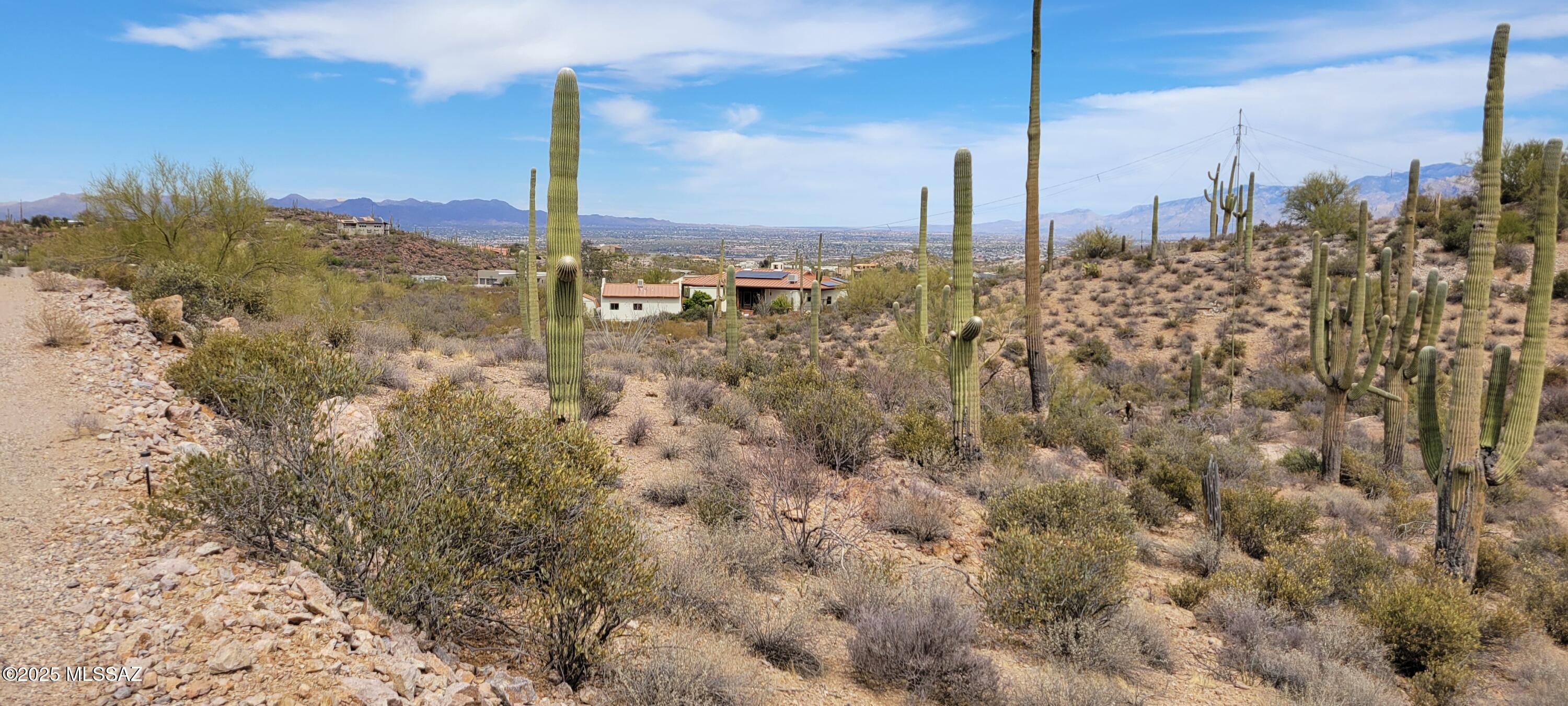 Absolutely Gorgeous and priced aggressively  to Sell quick! This gated subdivision with beautiful rolling hills is filled with custom homes with 3.3 acres minimum Zoning. If you are looking for peace and quiet with City View and Mountain views then look no further. This listing is for two lots for a total of
 Over 13.32 acres with parcel numbers 214-37-024L and 214-37-024N.The 9 acre
 has no address yet but Access is through Sunset Rd (please use address for the geodesic dome at the end of the dirt road: 6485 W. Sunset Rd.).
 Water and electric at lot line for the 3.3 acre. There are NO Deed restrictions!! 
Owner says he can sell the parcels separately: 9.7 acre for $85K and 3.3 acre for $75K. Hurry On this great bargain!! This low low price is Firm!