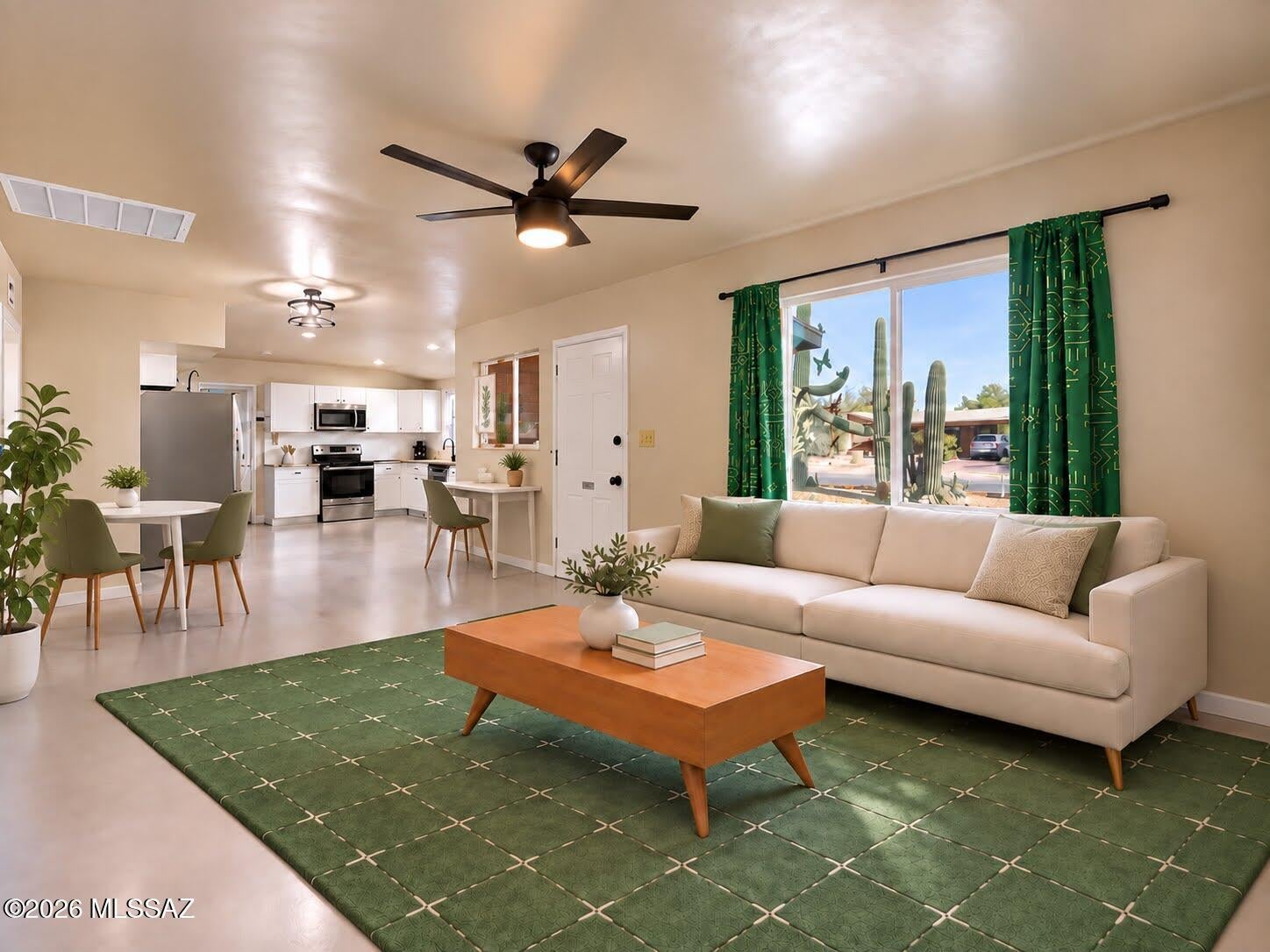 Charming mid-century modern adobe brick home in a desirable central Tucson neighborhood with Catalina Mountain views. Lush desert landscaping includes two dozen cacti and two towering saguaros, and the large backyard draws birds, rabbits and other wildlife. Rooftop solar cuts electric bills, and the all-electric home has an efficient heat pump. A separate studio has private front and rear entrances, a mini-split and a discreet laundry closet, making it ideal for an artist, office or workshop. Remodeled to keep its mid-century character, the home has an updated kitchen with granite counters, custom concrete floors, updated baths and dual-pane windows, and is wired for fiber optic internet. Room for a pool or garden. Close to UA, Tucson Botanical Gardens, parks, dining and shopping.