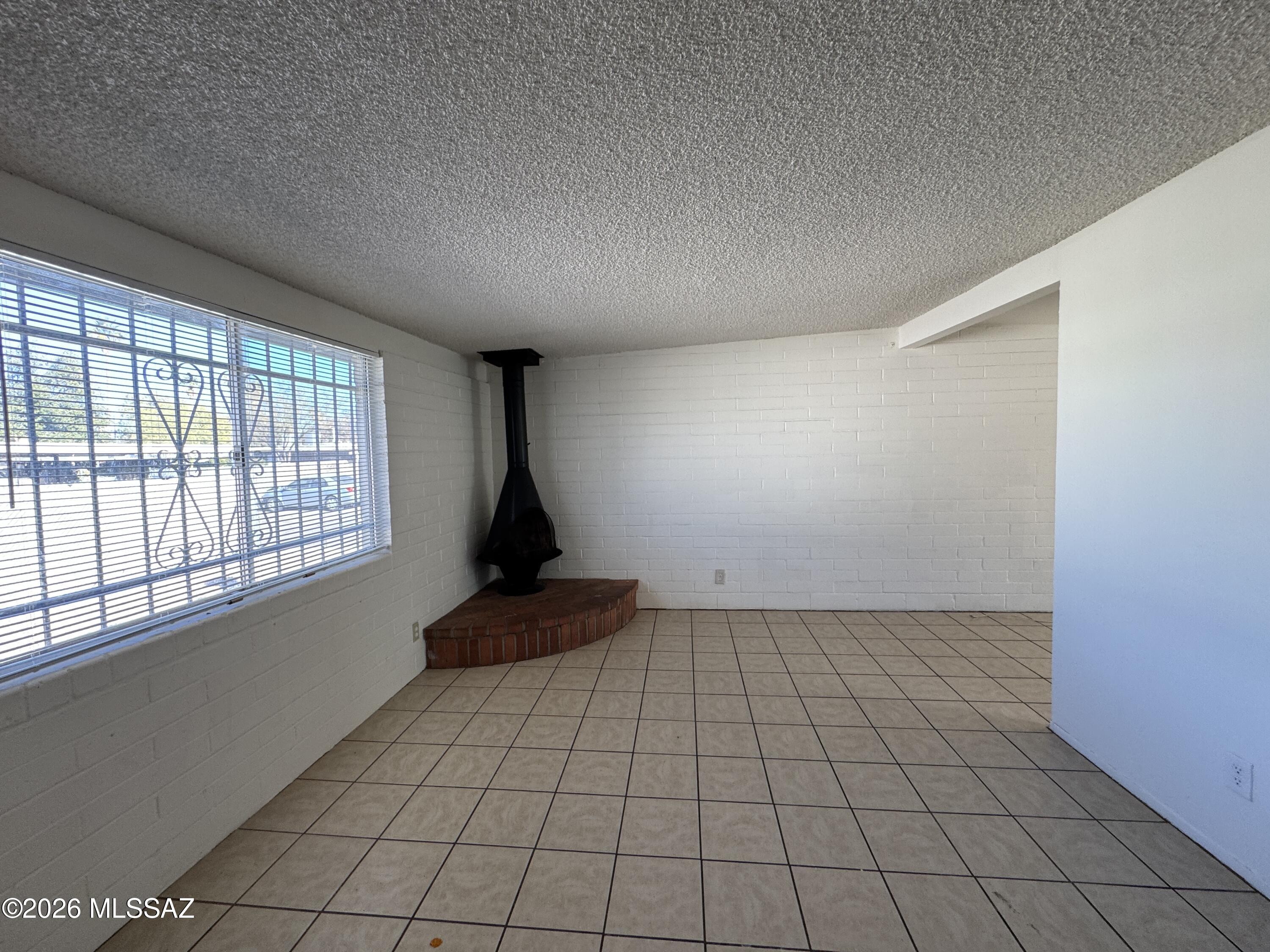 Introducing a charming 2 bedroom, 1 bathroom house in Tucson, AZ. This cozy home features tile and carpet flooring, a spacious open kitchen, and convenient washer/dryer hookups. With covered parking, a large fenced yard, and extra storage areas, this property offers both comfort and functionality. The extra room provides flexibility for a home office or additional living space. Located near Davis Monthan and with easy access to the I-10, this home is perfect for those seeking convenience and accessibility. Don't miss out on this opportunity - schedule a viewing today as this property will not last long!