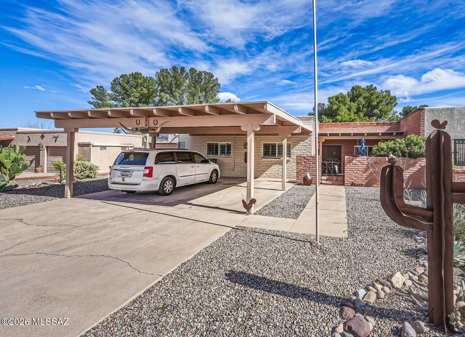 Beautifully located on Green Valley Country Club golf course with the majestic Santa Rita Mountains beyond!  Outdoor entertaining on the lovely covered patio -what could be better?  This unique townhome has 3 bedrooms, 2 baths and a tandem garage/workshop.  In addition the 2 car carport and driveway provides plenty of space for several cars.  Light-filled GreatRoom leads to the dining room which spills onto the patio.  The charming kitchen looks onto the front courtyard. and the dining room.  Owner's suite has plantation shutter sliding doors to the patio., 3 closets and brick tiled bath.  Country Club Estates neighborhood has wide county-maintained streets  as well as sidewalks for those morning walks with your dog!  Low HOA of $36 annually!! Green Valley Rec facilities nearby!