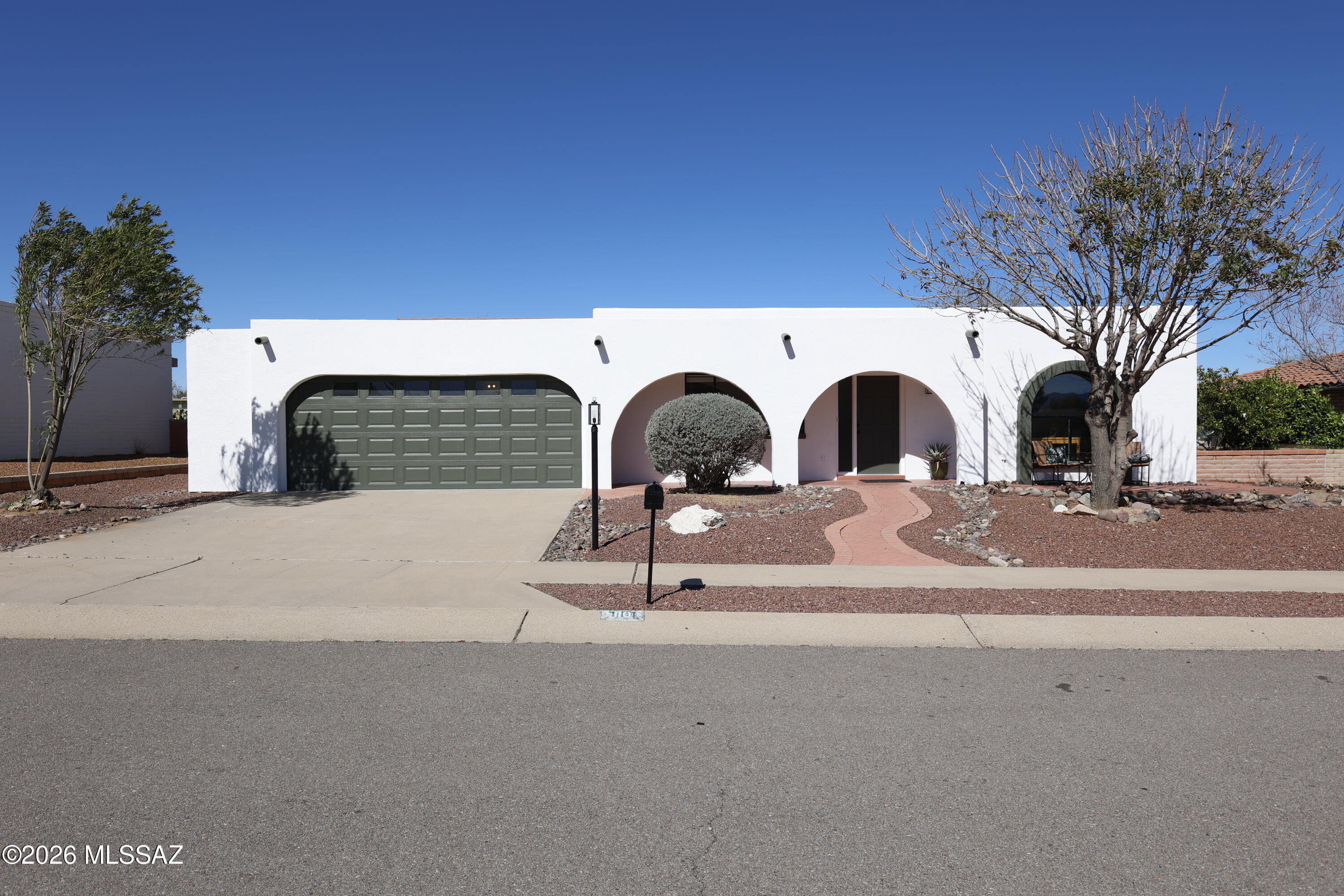 Totally refreshed & move-in-ready! (55+ Community) Discover comfort, convenience, and unbeatable value in this delightful Green Valley home. Part of the GVR and just moments from some of the area's most popular amenities. This property sits in a subdivision known for its ultra affordable HOA, proximity to groceries and genuinely friendly neighborhood feel. Inside, you'll find two inviting living spaces and an oversized laundry room that allows for versatility as a hobby or office space. The enclosed/extended garage offers great flexibility for storage. Step out back to a north-facing yard complete with a giant covered patio and mature citrus trees. Updates include: new appliances, new interior+exterior paint, new light fixtures, new hardware, granite counters, new sinks/faucets, new carpet