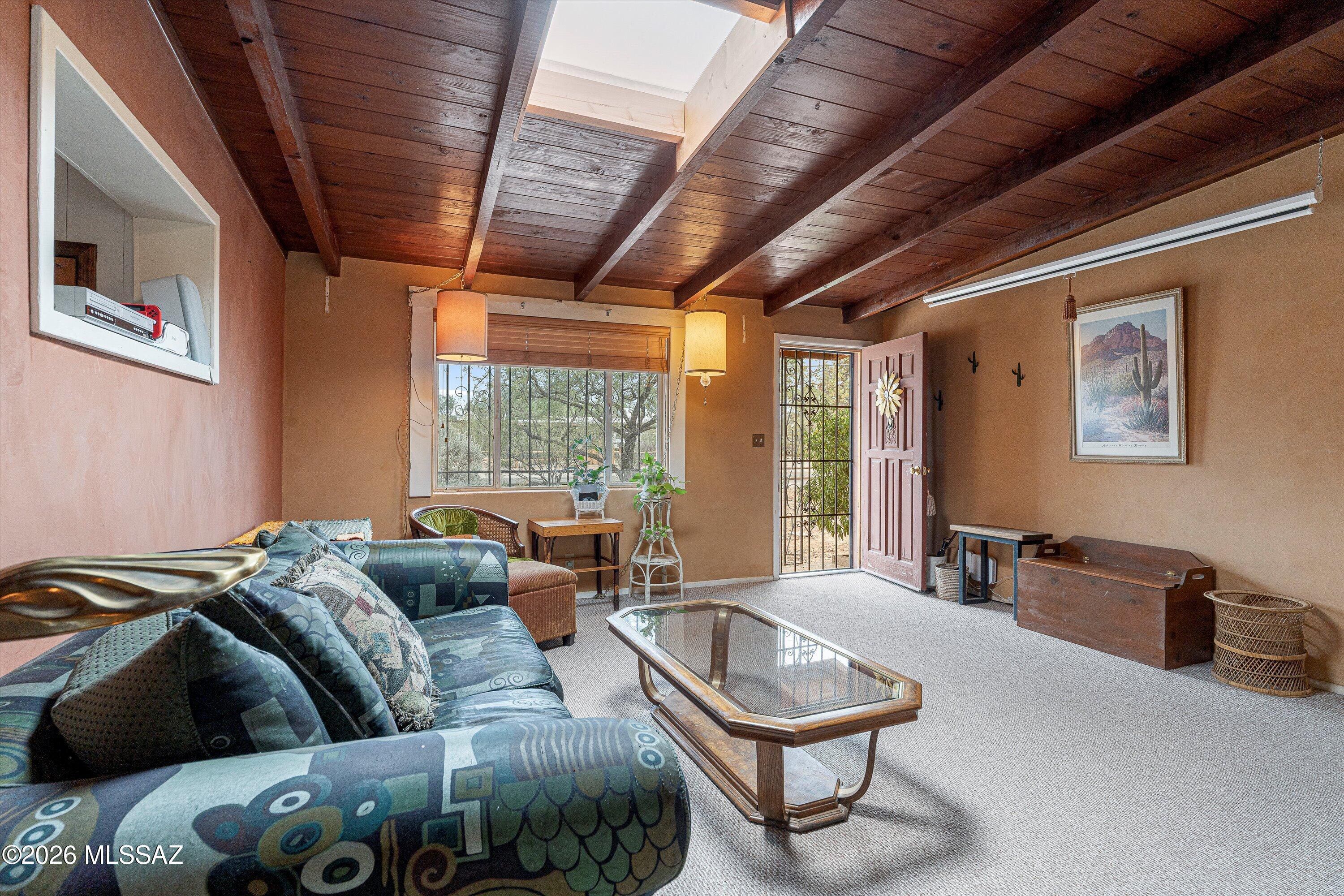 Huge 3 bedroom midcentury ranch, on the market for only the second time ever! Sitting on over 1/3 of an acre right in midtown, this gorgeous home offers all of the charm and character you expect to find in the San Carlos neighborhood. Gorgeous exposed beam ceilings throughout, a thoughtful layout provides an excellent guest room, an enormous enclosed Arizona room with a built in bar, and even a separate dedicated office area! New roof, HVAC, and ductwork in 2023. New concrete floors in Arizona room.